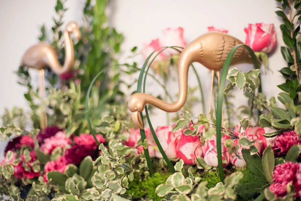 Raleigh wedding photographer Mikkel Paige captures Mim's House opening night, with an Alice in Wonderland theme including gold flamingos!