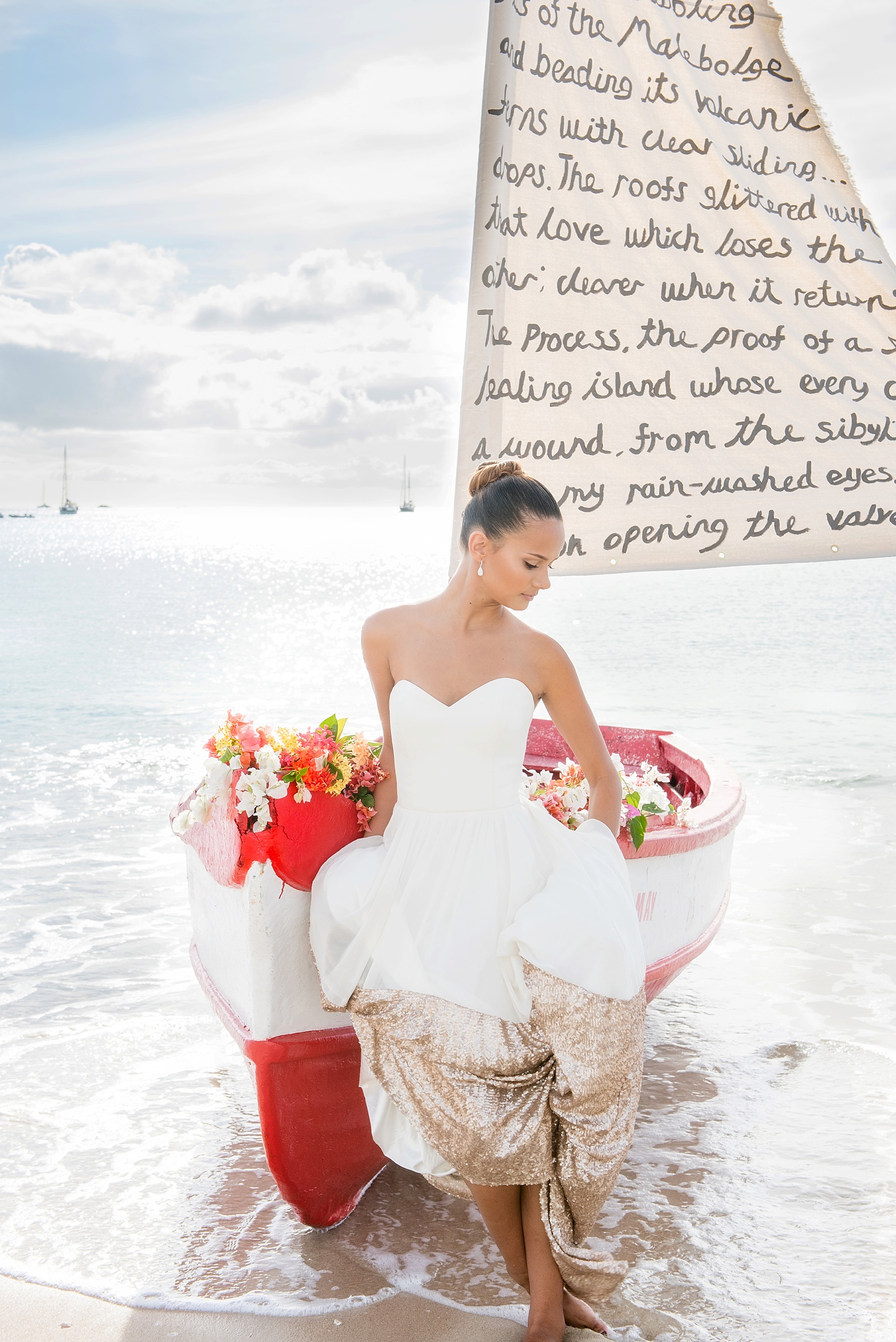 St. Lucia destination wedding beach elopement by Mikkel Paige Photography, at The Landings. Gown by Truvelle and calligraphy sail by Burnett's Boards.