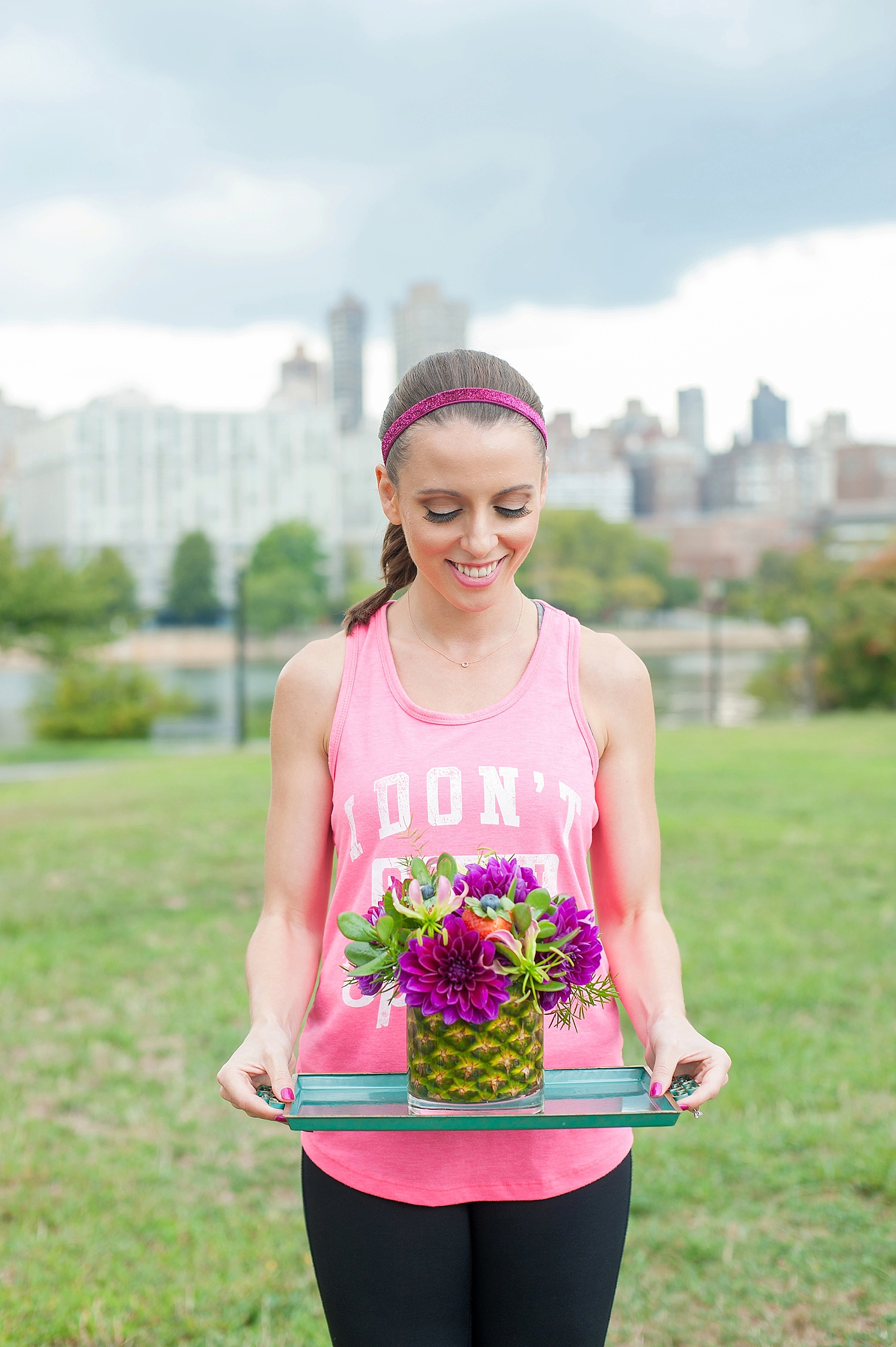 Mikkel Paige Photography photos for a fitness styled shoot with Michelle Elaine Weddings. Fruit filled floral arrangements with pineapple vase by Petals and Roots, Astoria, NY. 