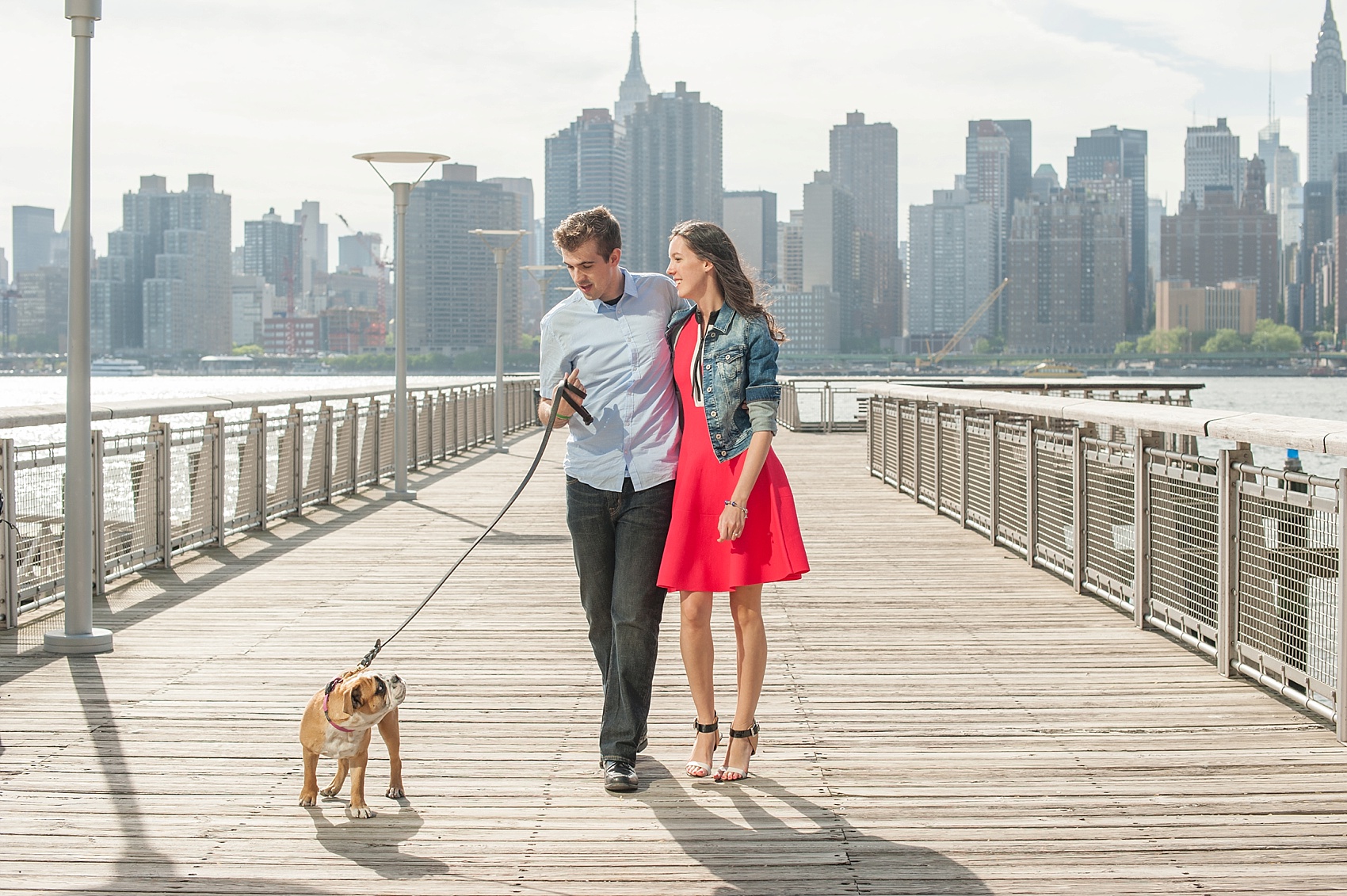 Long Island City waterfront engagement session at Gantry State Park by Mikkel Paige Photography, NYC wedding photographer. Their English Bulldog puppy came along for the photo session!