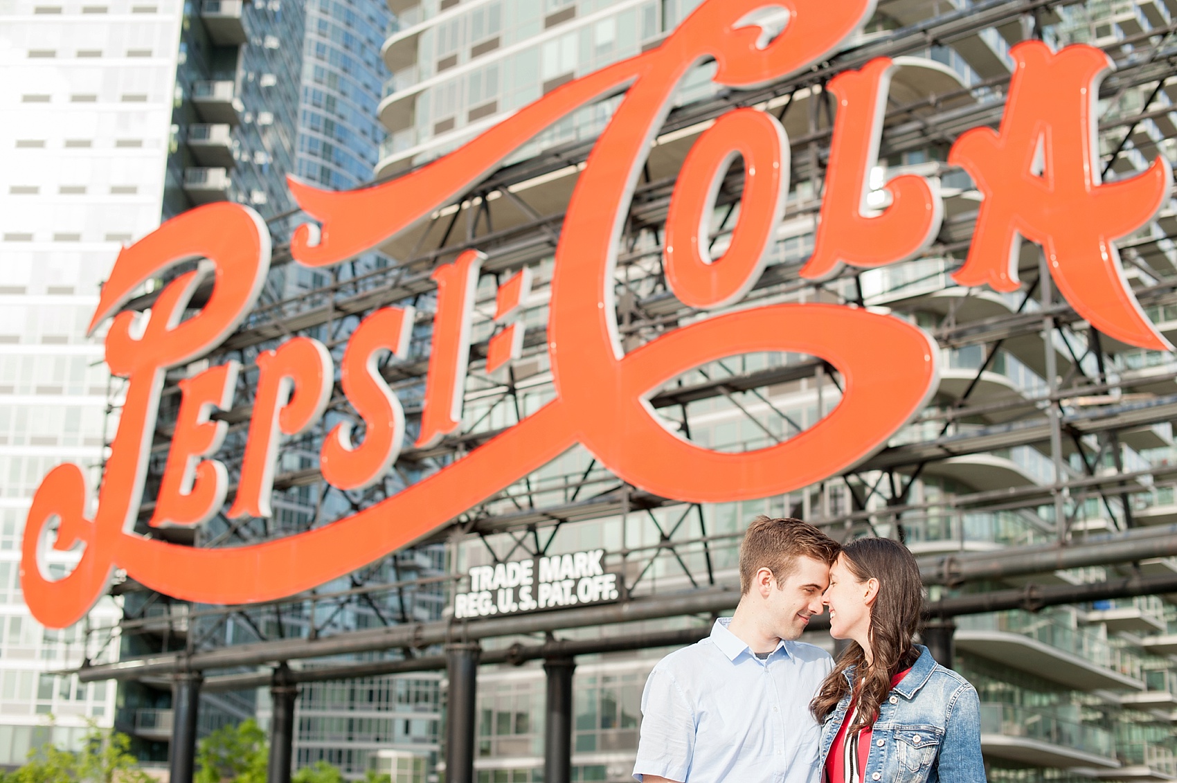 Long Island City waterfront engagement session at Gantry State Park by Mikkel Paige Photography, NYC wedding photographer. The park is famous for vintage its Pepsi Cola sign.
