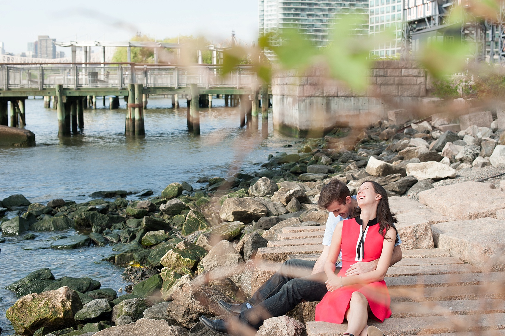 Long Island City waterfront engagement session at Gantry State Park by Mikkel Paige Photography, NYC wedding photographer. The park overlooks the Manhattan/NYC Skyline.