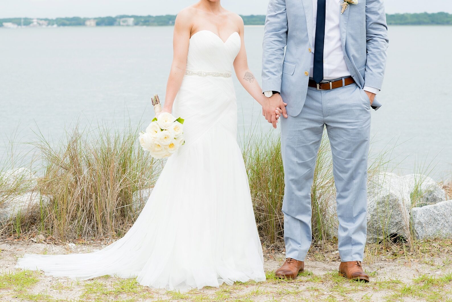 Bride and groom waterfront photos in Haig Point, South Carolina, off the coast of Hilton Head. Photos by Mikkel Paige Photography.