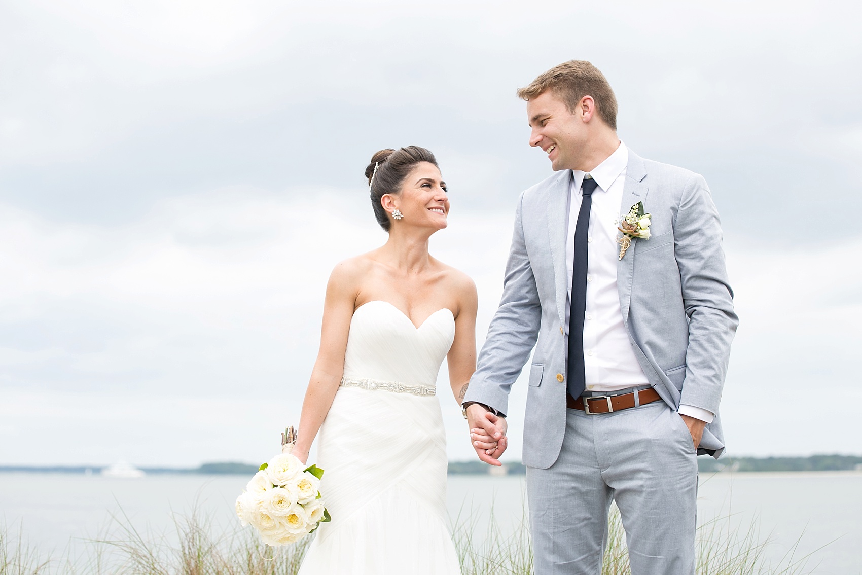 Bride and groom waterfront photos in Haig Point, South Carolina, off the coast of Hilton Head. Photos by Mikkel Paige Photography.