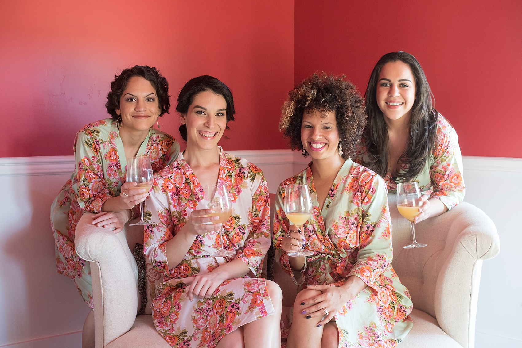 Bride prepares for her vineyard elopement with Mikkel Paige, destination wedding photographer. Held at HammerSky Vineyard, south of San Francisco. Pictured with her bridesmaids in floral robes. 