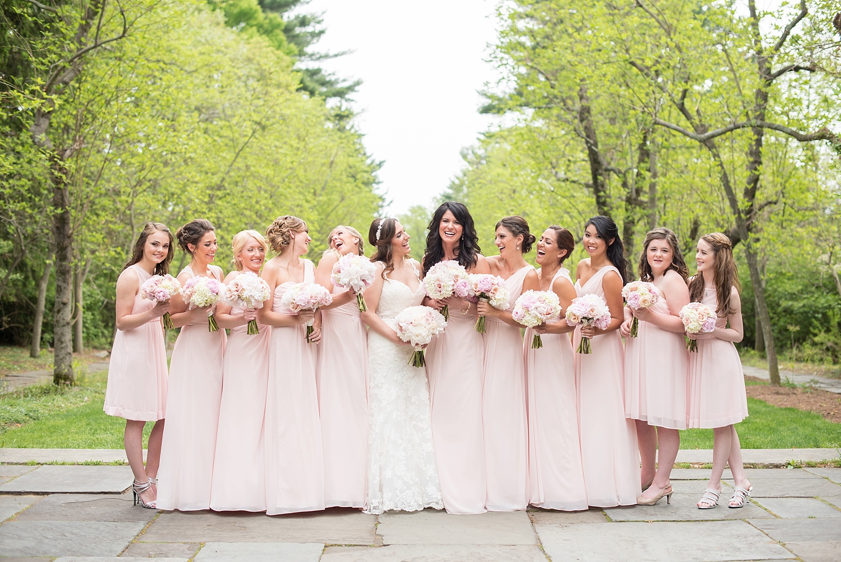 Wedding party with bridesmaids in blush pink. Photos at a Skylands Manor wedding. Images by Mikkel Paige Photography, NJ wedding photographer.