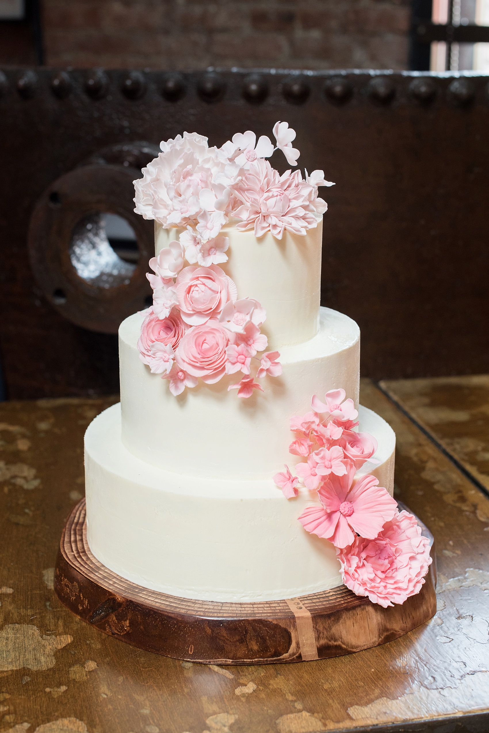 Rustic romantic wedding at My Moon Brooklyn, Williamsburg NYC. Photos by Mikkel Paige Photography. White and pink flower cake by Nine Cakes.