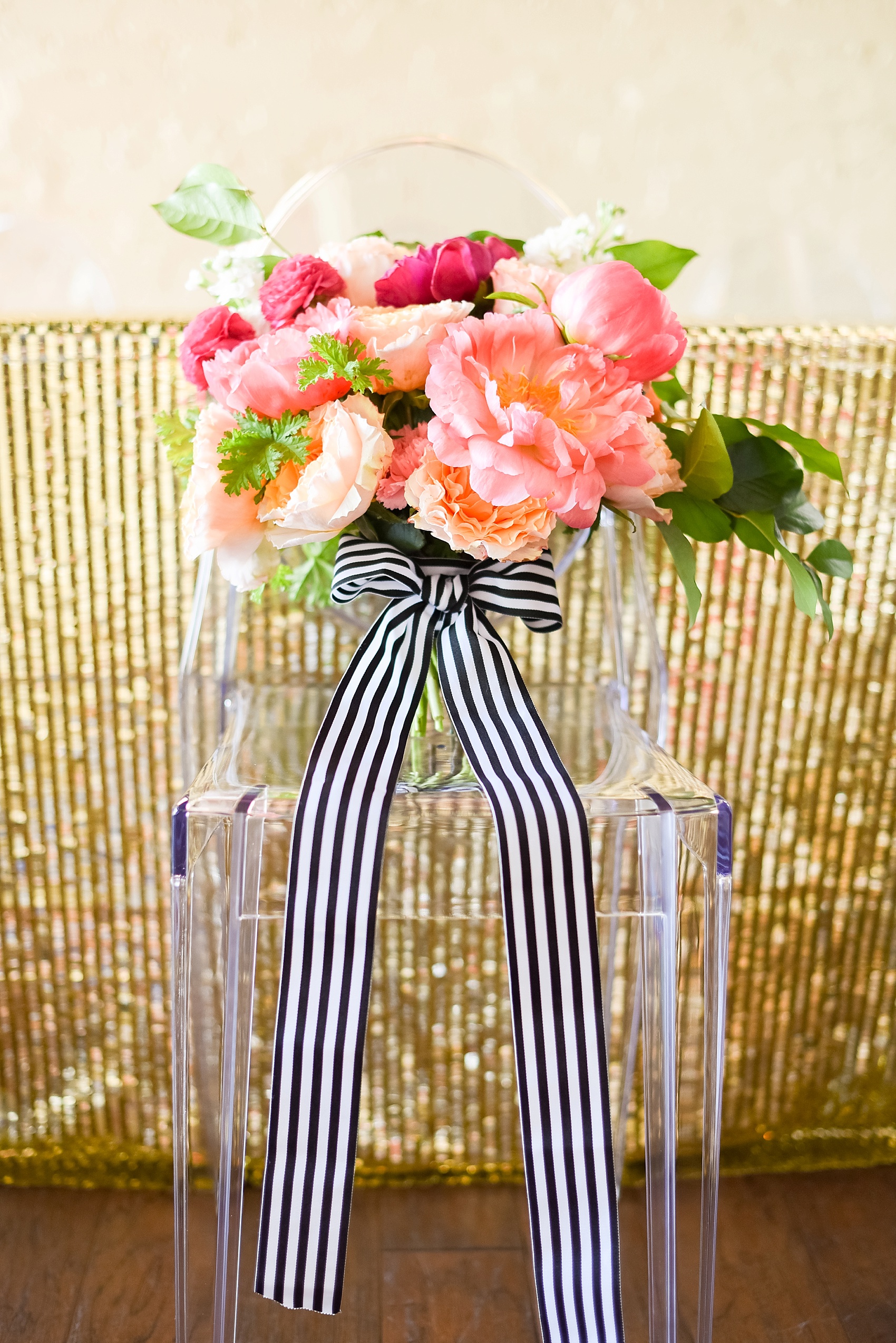 Modern pink and orange wedding ideas with colorful bouquet and black and white striped ribbon. Gold sequin linens round it out! Photos by Mikkel Paige photography, planning by Ashton Events and Every Last Detail.