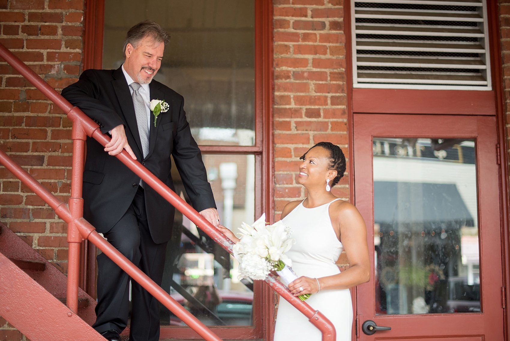 Downtown Raleigh, NC mixed race wedding. Photos by Mikkel Paige Photography. Photos of the bride and groom. 