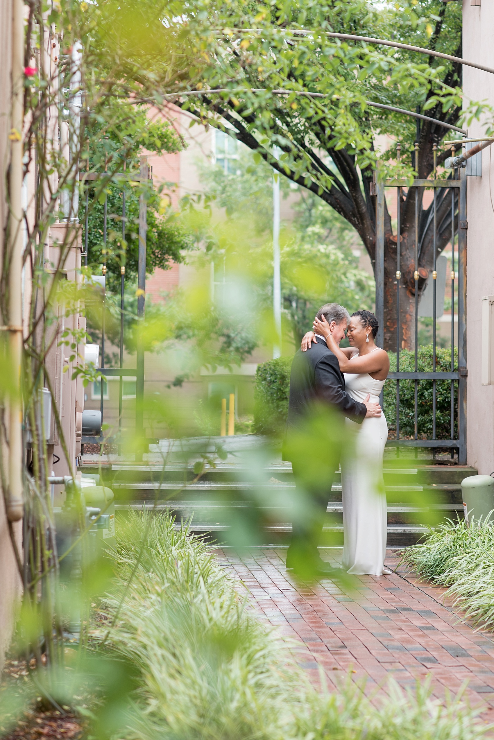 Downtown Raleigh, NC mixed race wedding. Photos by Mikkel Paige Photography. Photos of the bride and groom.