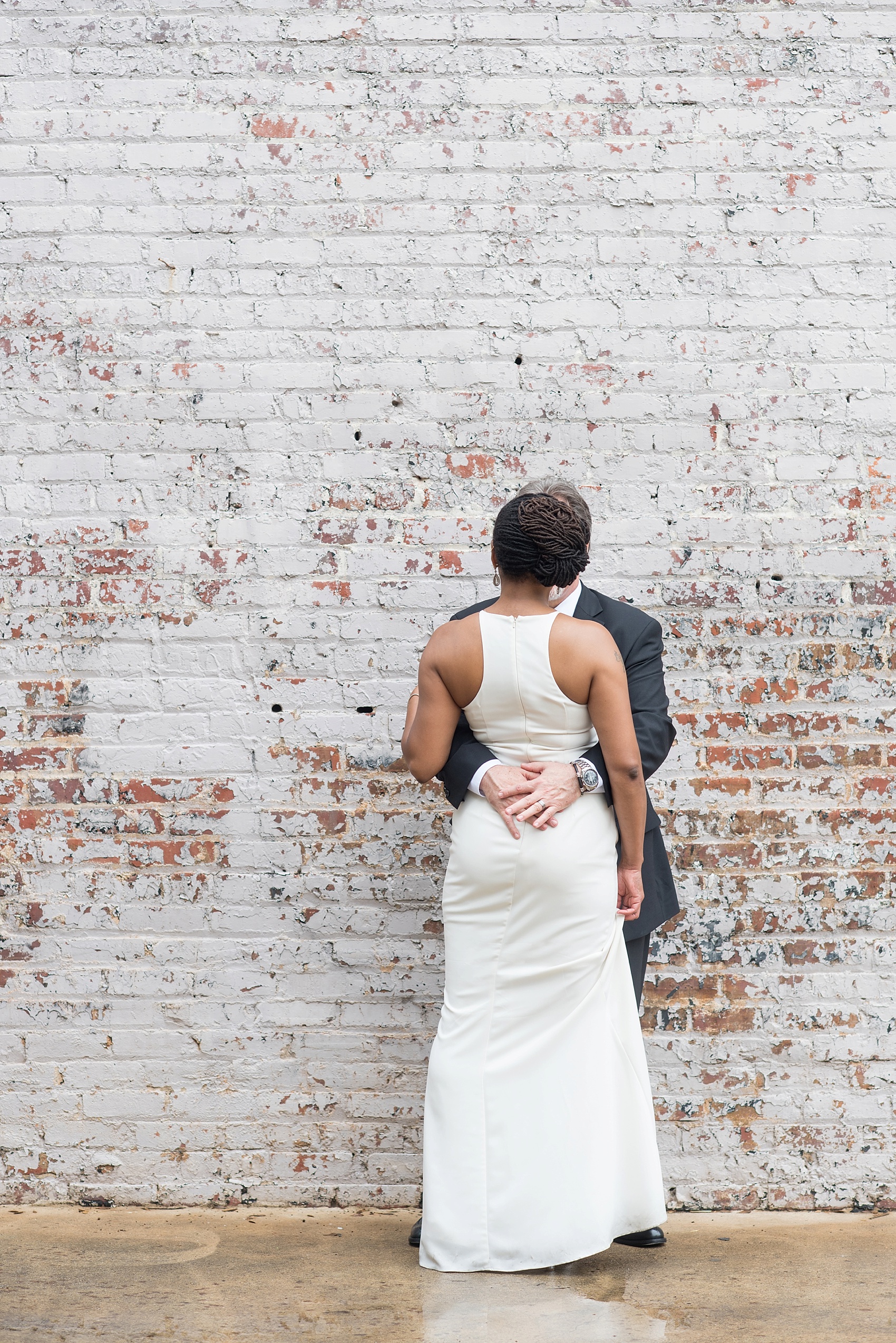 Downtown Raleigh, NC mixed race wedding. Photos by Mikkel Paige Photography. Photos of the bride and groom. 