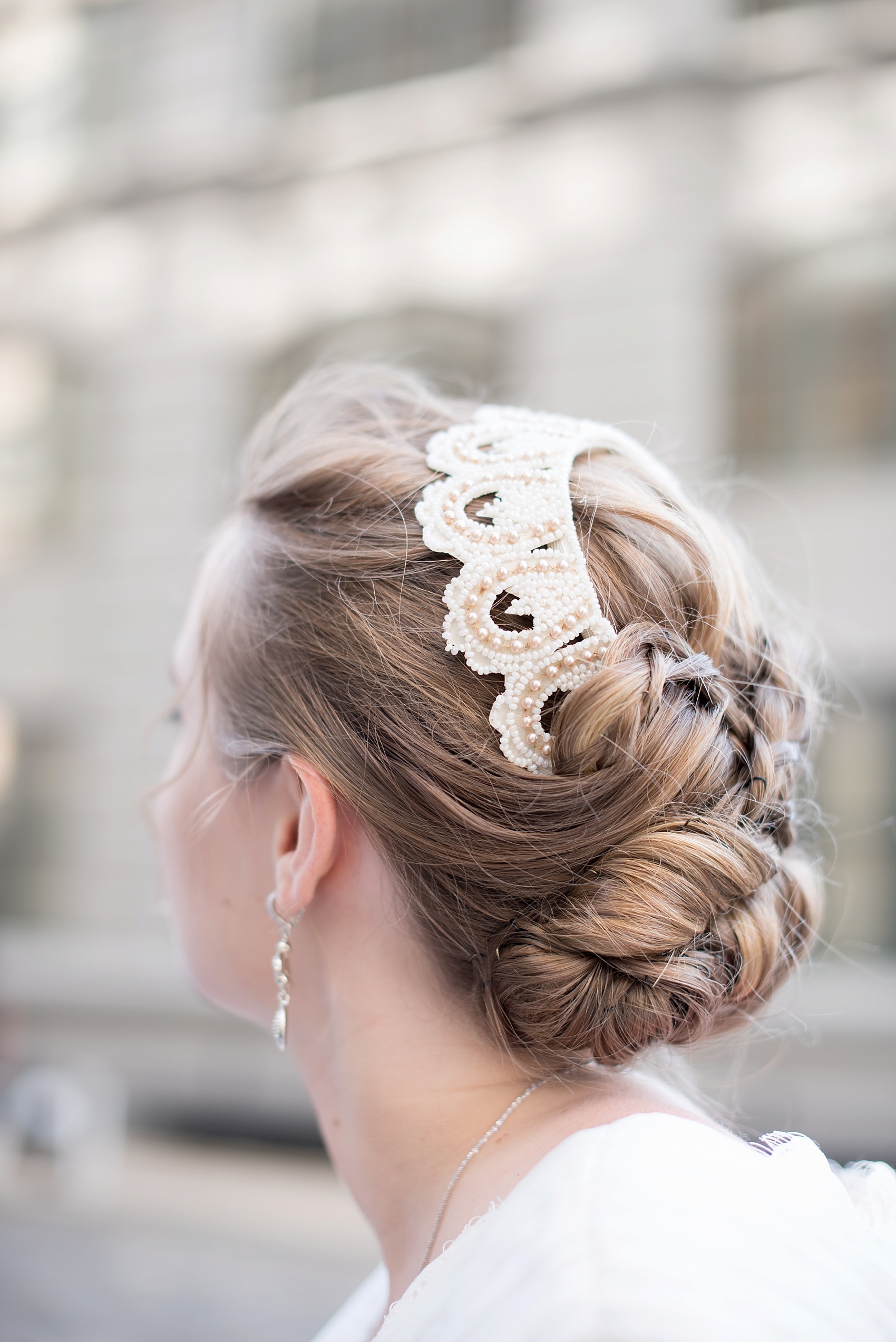 Wedding photos of the bride's up-do and heirloom beaded hair piece. Wedding at Brooklyn Bridge Park. Photos by Mikkel Paige Photography, NYC wedding photographer.