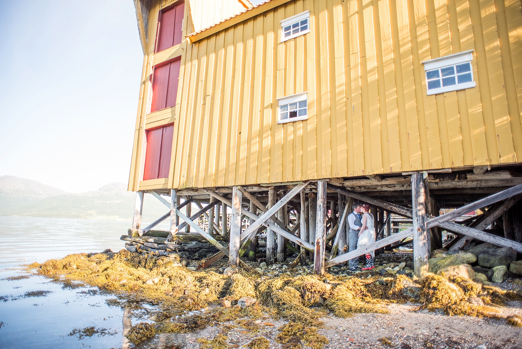 Norway wedding photos by Mikkel Paige Photography, destination wedding photographer. Bride and groom waterfront photos.