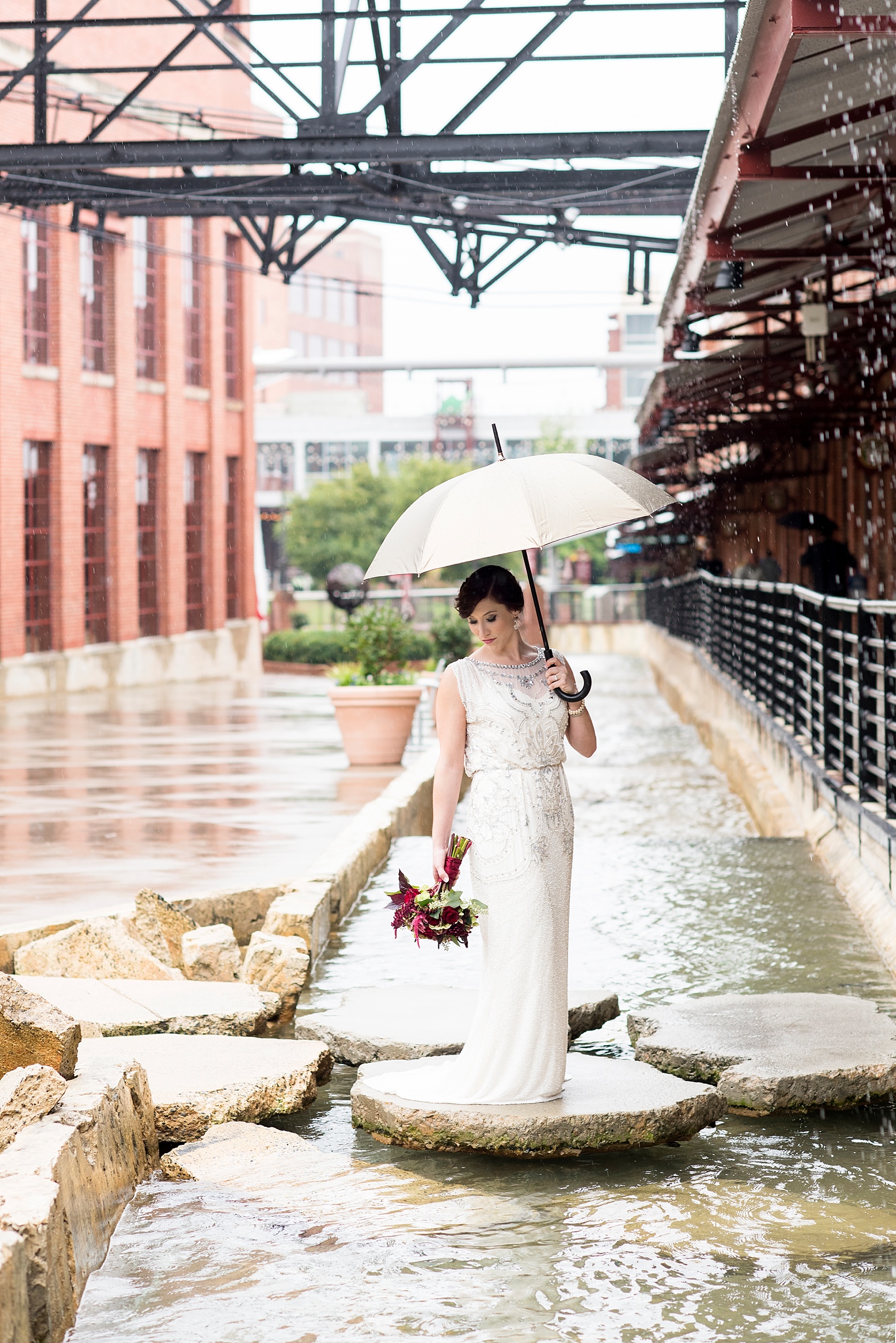 Wedding party photos in the rain! Bride in beaded 1920s art deco gown. Bay 7 Durham, NC wedding. Photos by Mikkel Paige Photography.