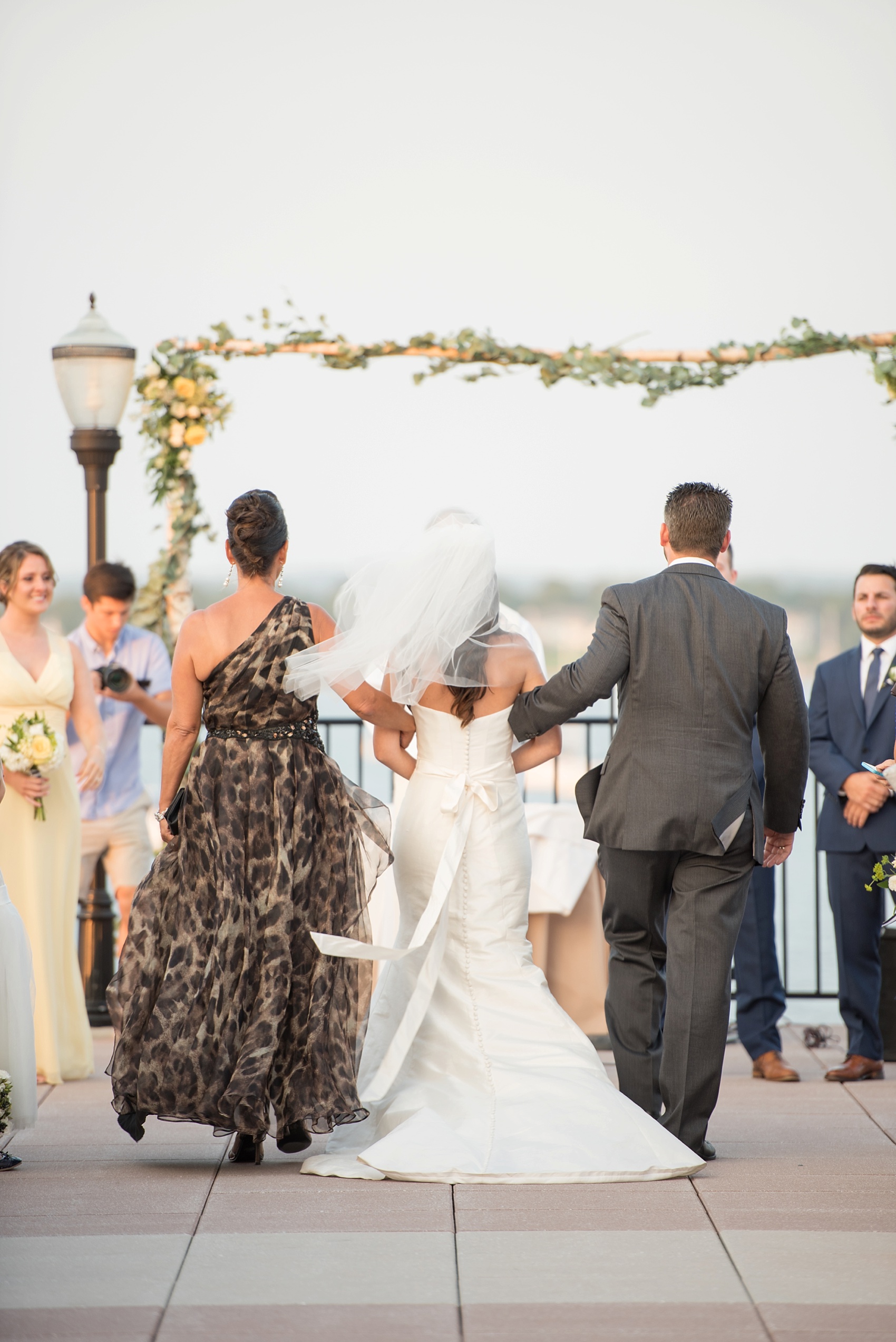New Jersey waterfront wedding ceremony for a nautical day at the Molly Pitcher Inn. Photo by Mikkel Paige Photography.
