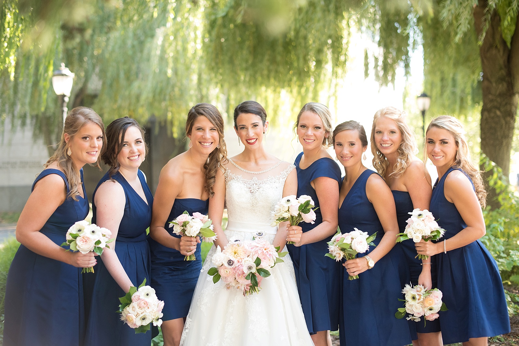 Bridesmaids in JCrew navy blue. Photos in Battery Park by NYC wedding photographer, Mikkel Paige Photography.