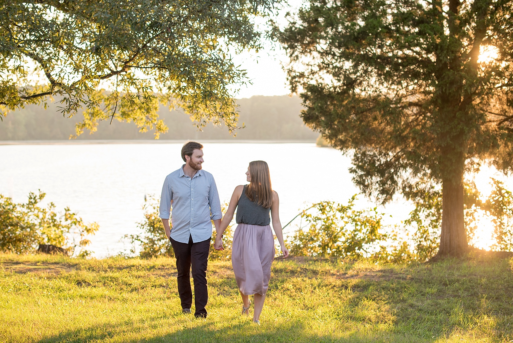 Raleigh, North Carolina engagement photos by Mikkel Paige Photography. Golden hour at Lake Raleigh.