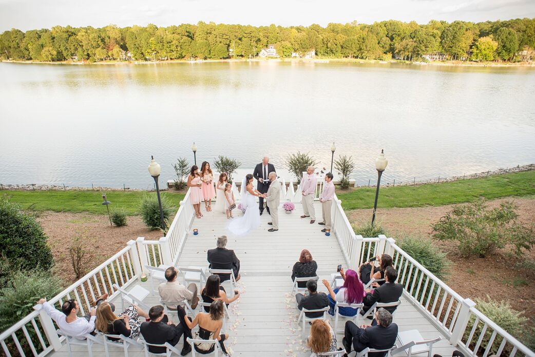 Raleigh wedding photos by Mikkel Paige Photography. Intimate small wedding at home with the ceremony overlooking a lake.