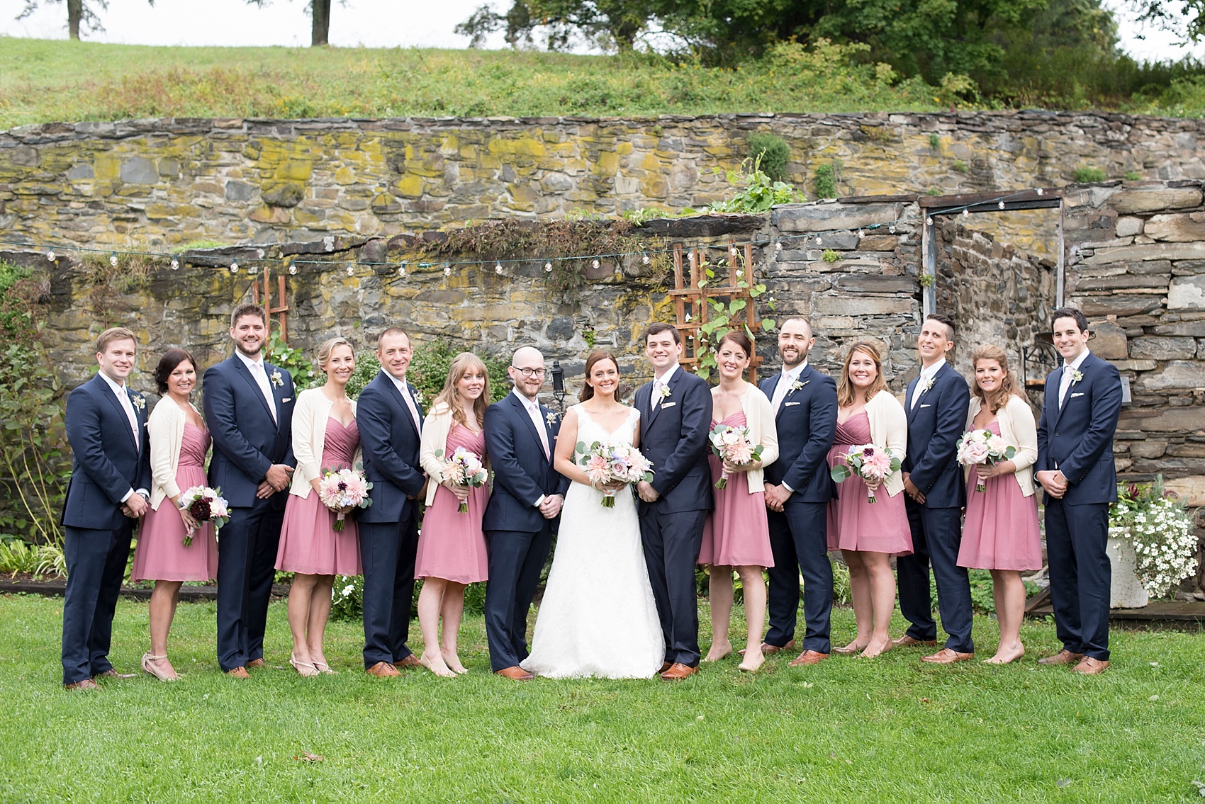 Red Maple Vineyard wedding. Photos by Mikkel Paige Photography. Bridesmaids in dusty rose short dresses and off white cardigans.