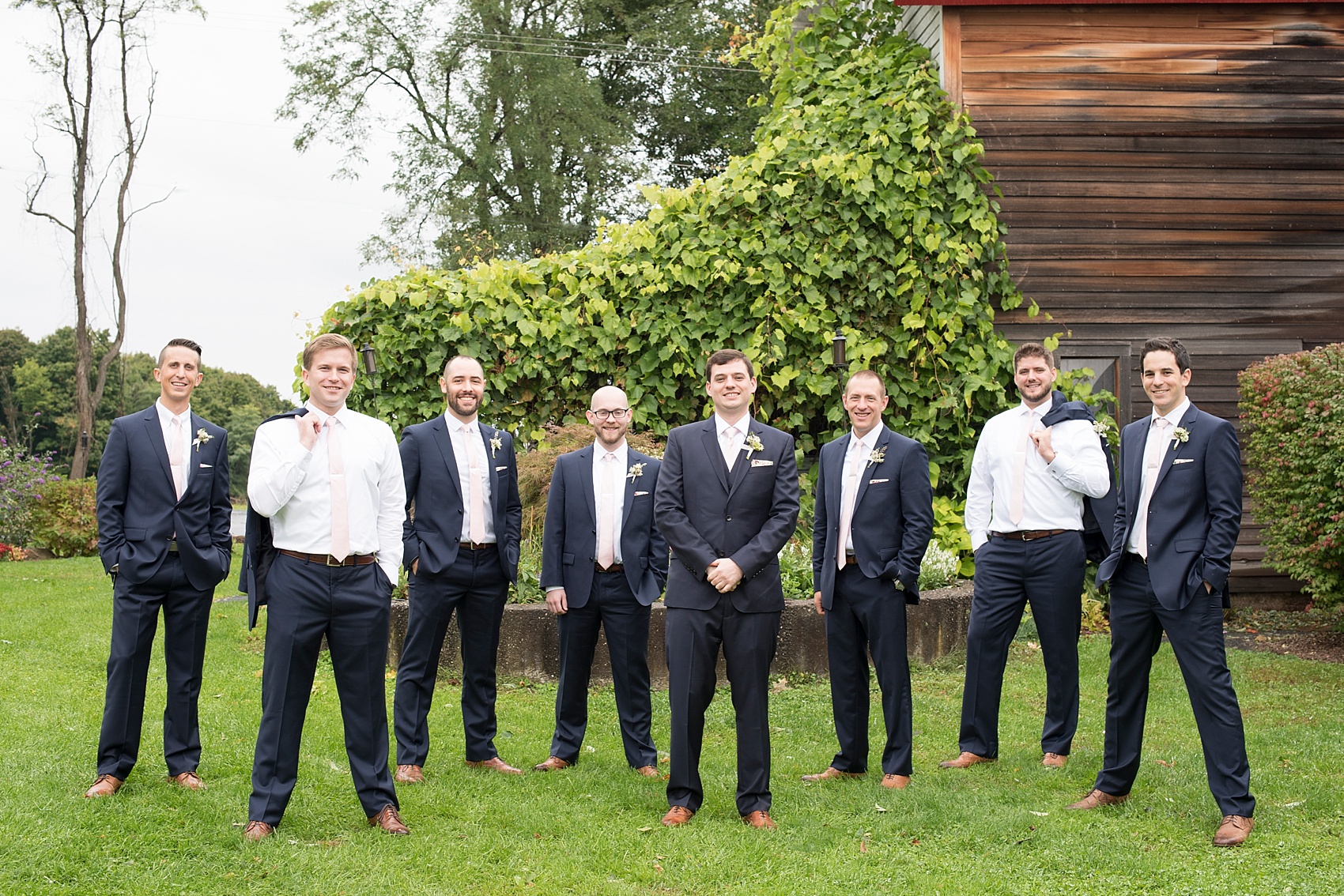 Red Maple Vineyard wedding. Photos by Mikkel Paige Photography. Groomsmen in navy suits and pink ties.