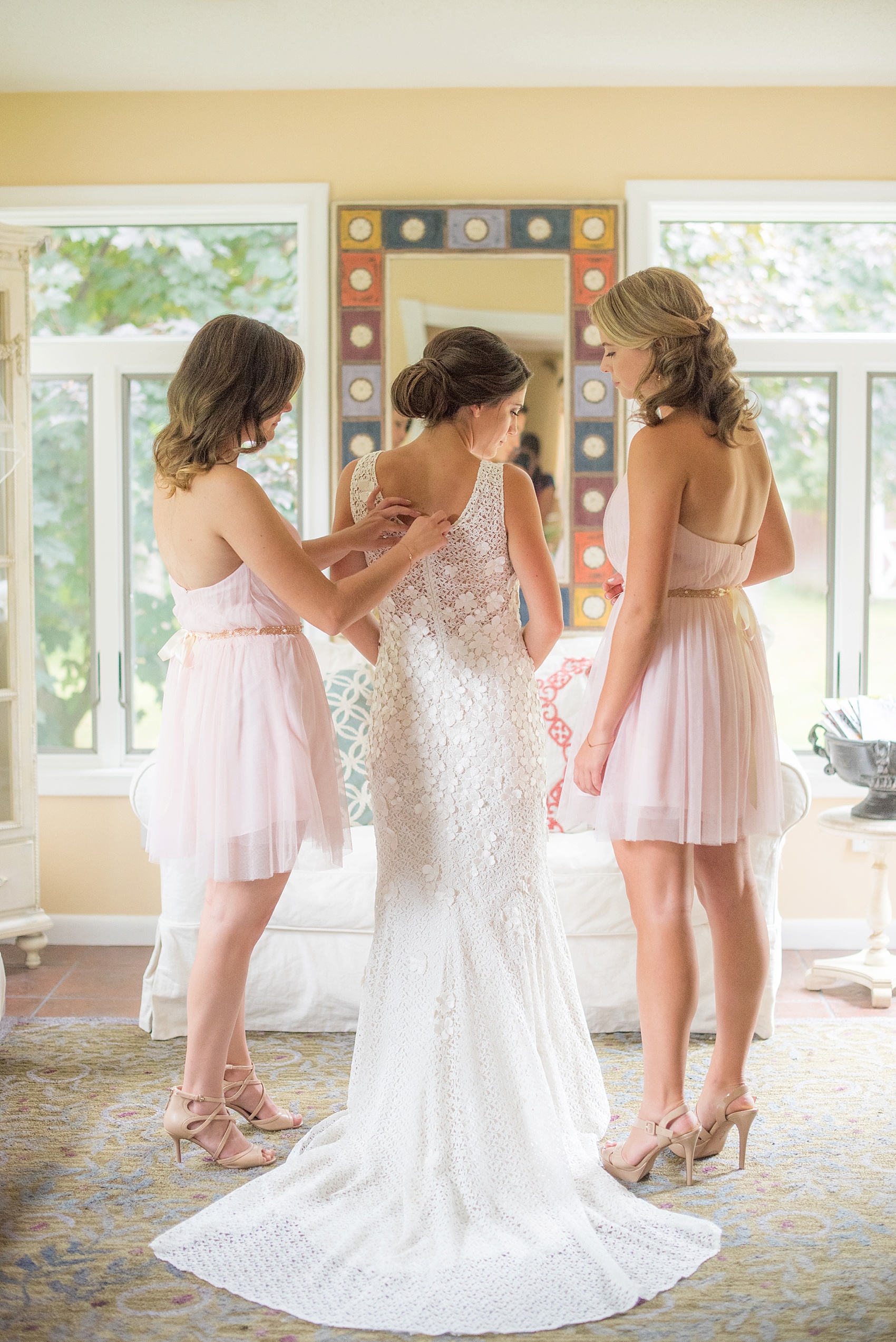 Getting ready wedding photos with pink bridesmaids. By NYC wedding photographer Mikkel Paige Photography.