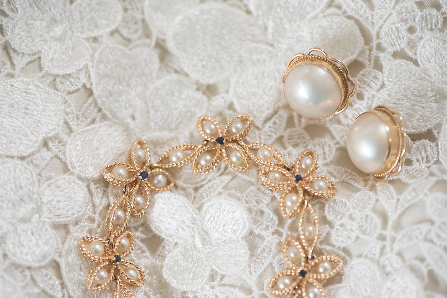 Wedding details - heirloom gold jewelry from the bride's grandmother. Images by NYC wedding photographer Mikkel Paige Photography.