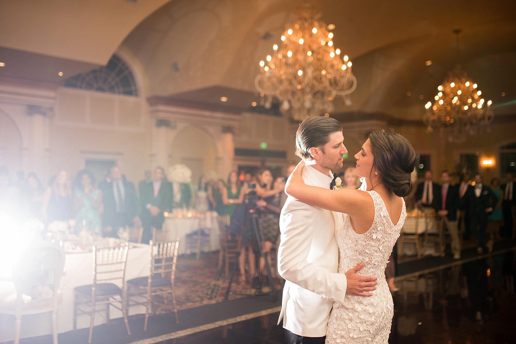 First dance with bridesmaids serenade for a wedding at The Riverview, Connecticut. Images by NYC wedding photographer Mikkel Paige Photography. Flowers by Diane Gaudett.