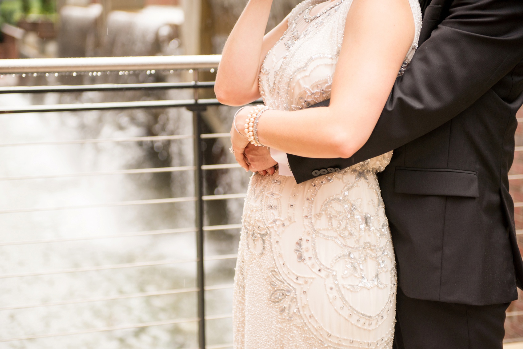 Bay 7 wedding photos by Mikkel Paige Photography. Raleigh wedding photographer captures the bride and groom's industrial outdoor portraits in the rain with an umbrella.