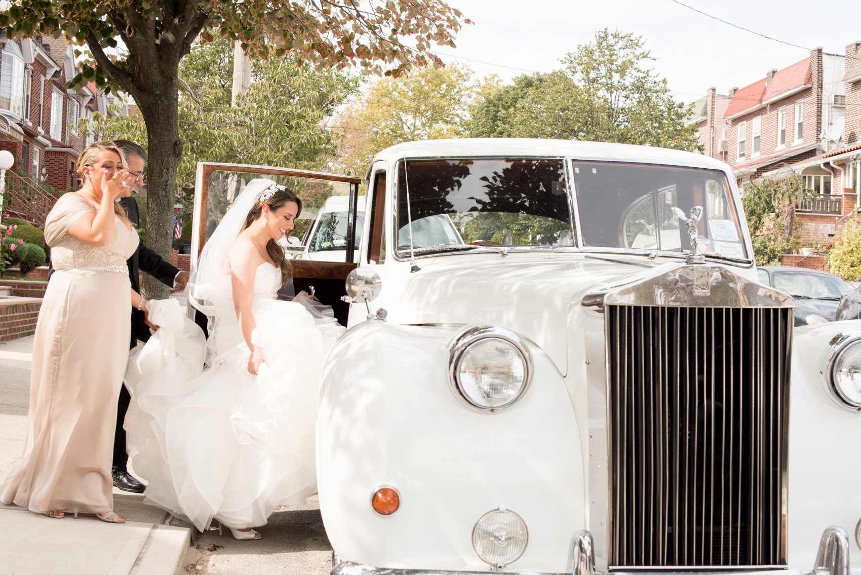 Colorful wedding photos by Mikkel Paige Photography, NYC wedding photographer. Planning by Dulce Dreams Events. Vintage Rolls Royce car for the bride.