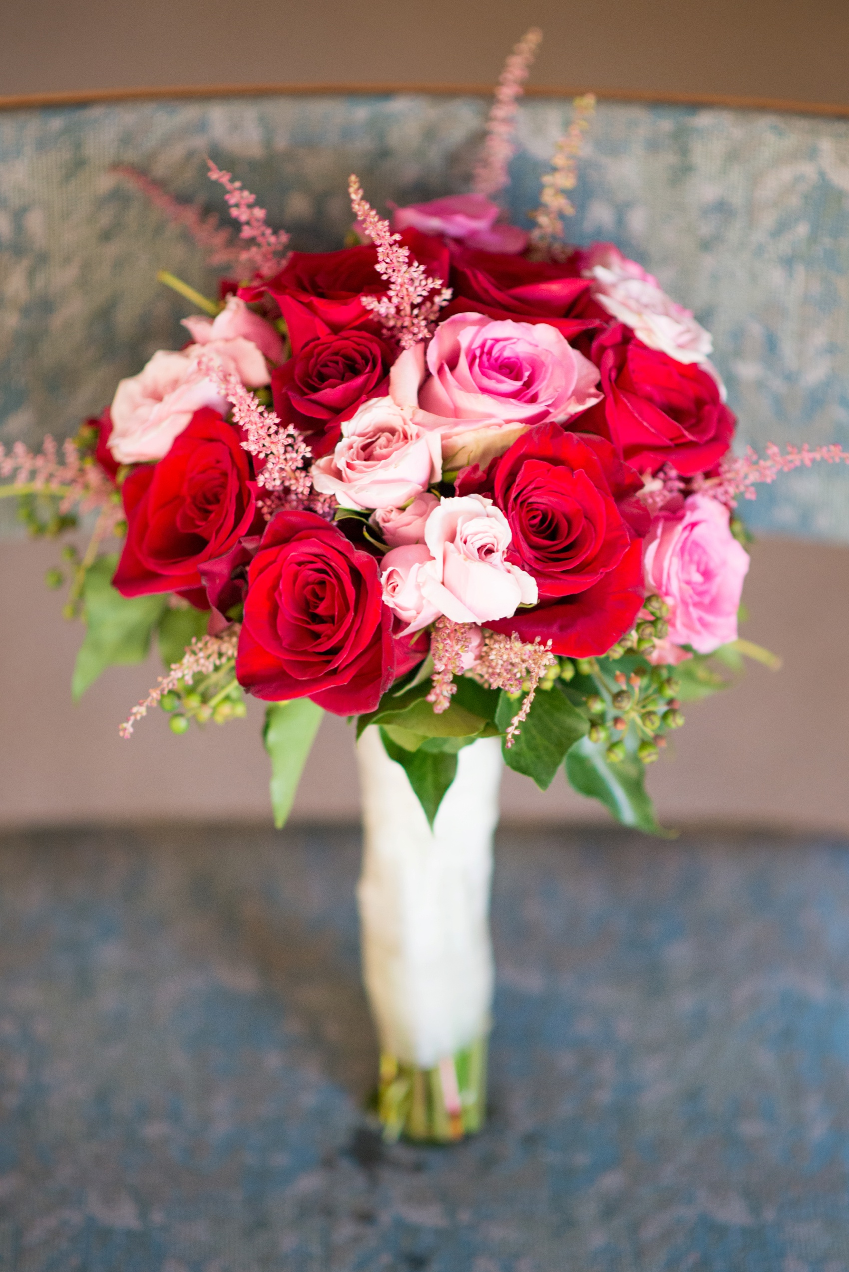 Intimate NJ church ceremony with images by Mikkel Paige Photography. Red and pink rose bouquet for the bride.