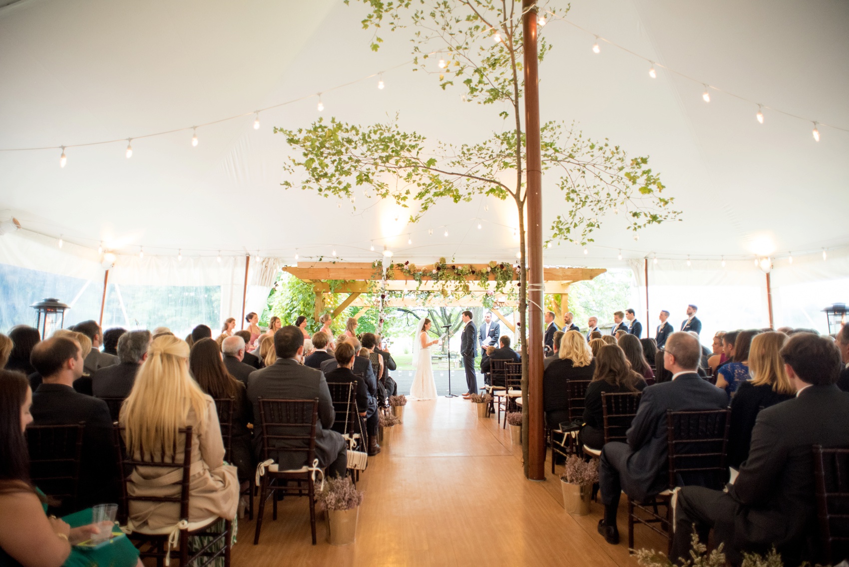 A Red Maple Vineyard wedding ceremony. Photo by NYC wedding photographer Mikkel Paige Photography.