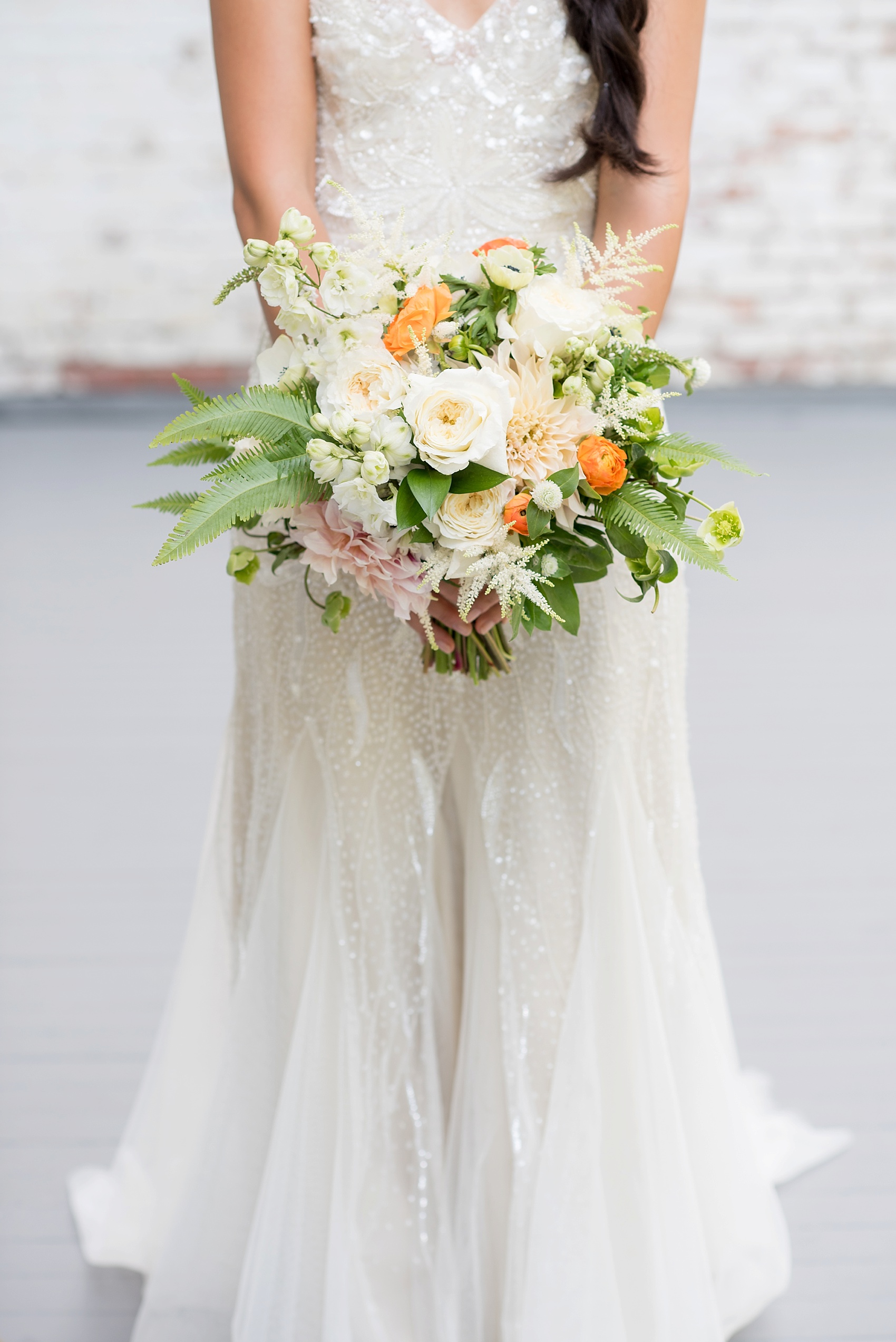 NY wedding at Southwood Estate. Images by Mikkel Paige Photography, NYC wedding photographer. Beaded wedding gown and wildflower bouquet of white, blue, green and orange by Sachi Rose.