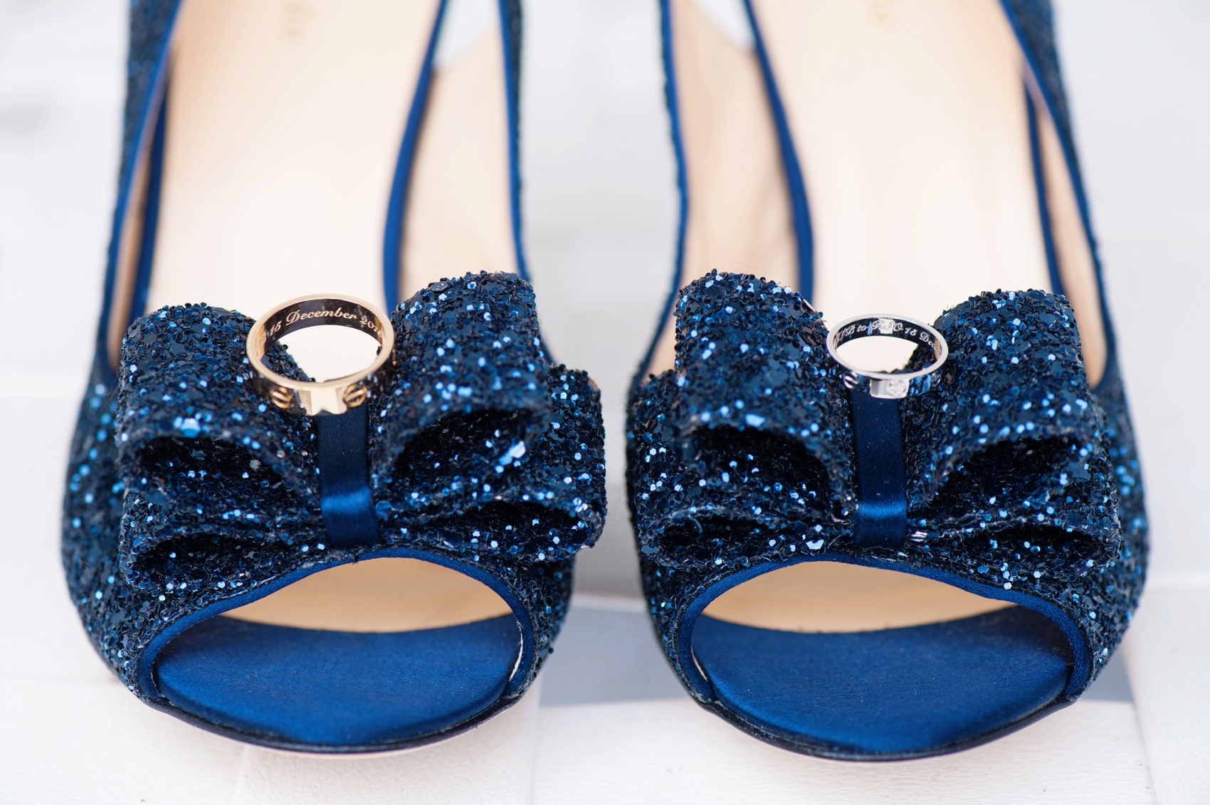 Disney World wedding photos by Mikkel Paige Photography, at Board Walk Hotel. Blue Kate Spade glitter heels with Cartier wedding bands.