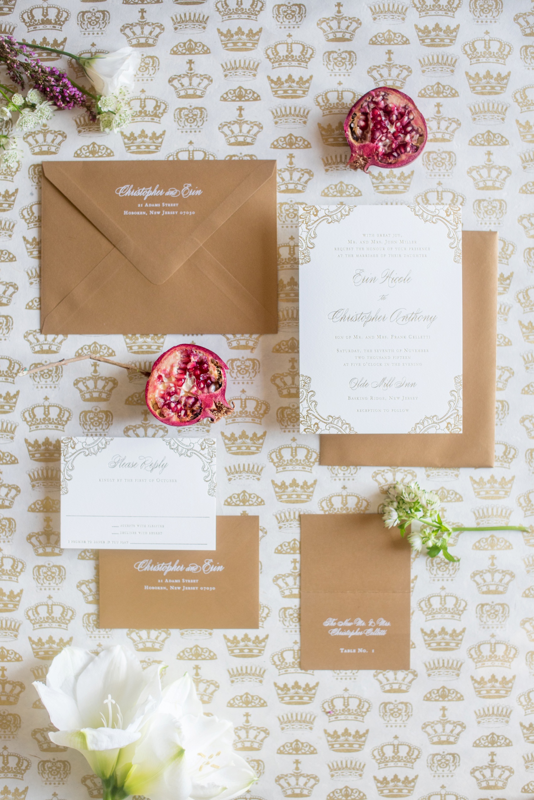 Gold and white invitation photo with pomegranate by Mikkel Paige Photography, NYC and Raleigh wedding photographer.