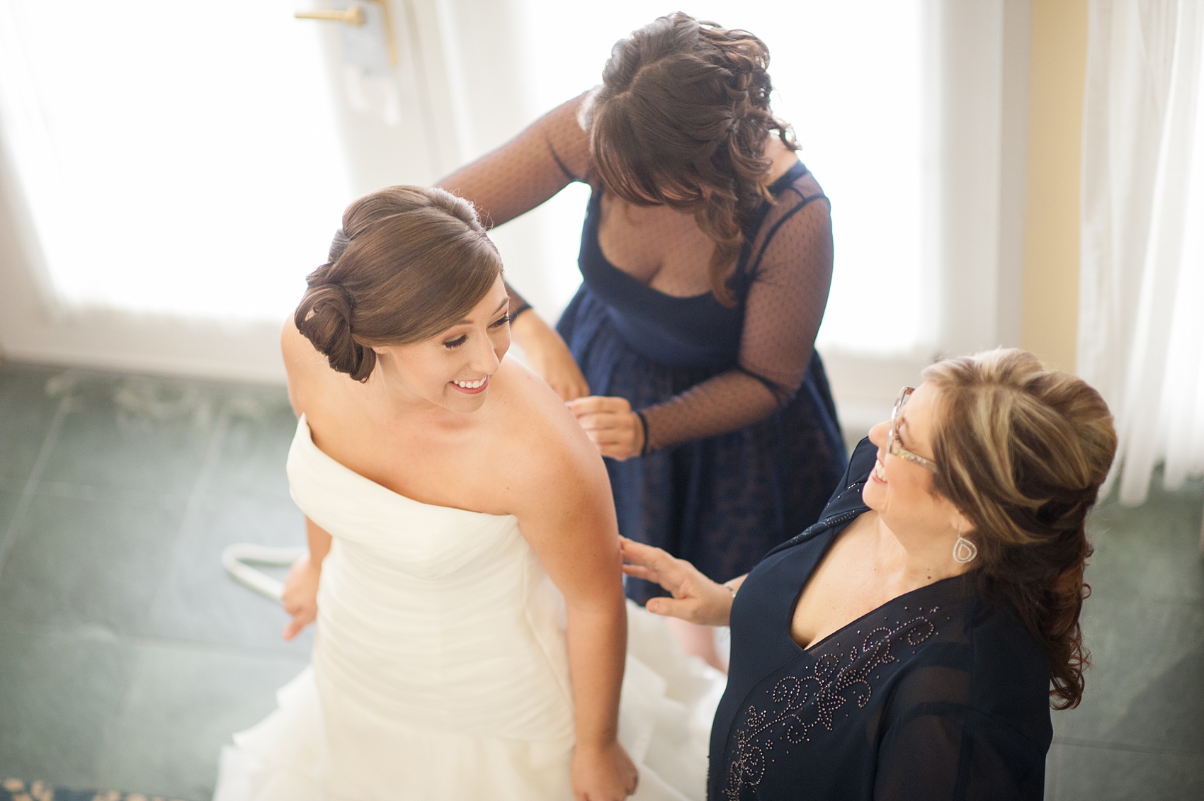 Walt Disney World wedding pictures at the Boardwalk venue, including a waterfront ceremony and Dance Hall reception near Epcot. These photos will give you unique, fun ideas from Glow in the Dark invitations to their Dole Whip flavored cake! Want to see more? Click through to Mikkel Paige Photography for more inspiration from this bride and groom's colorful day! #DisneyWedding #mikkelpaige #disneysboardwalk #DisneyWeddingVenue #DisneyBride #DisneyFan #MickeyEars