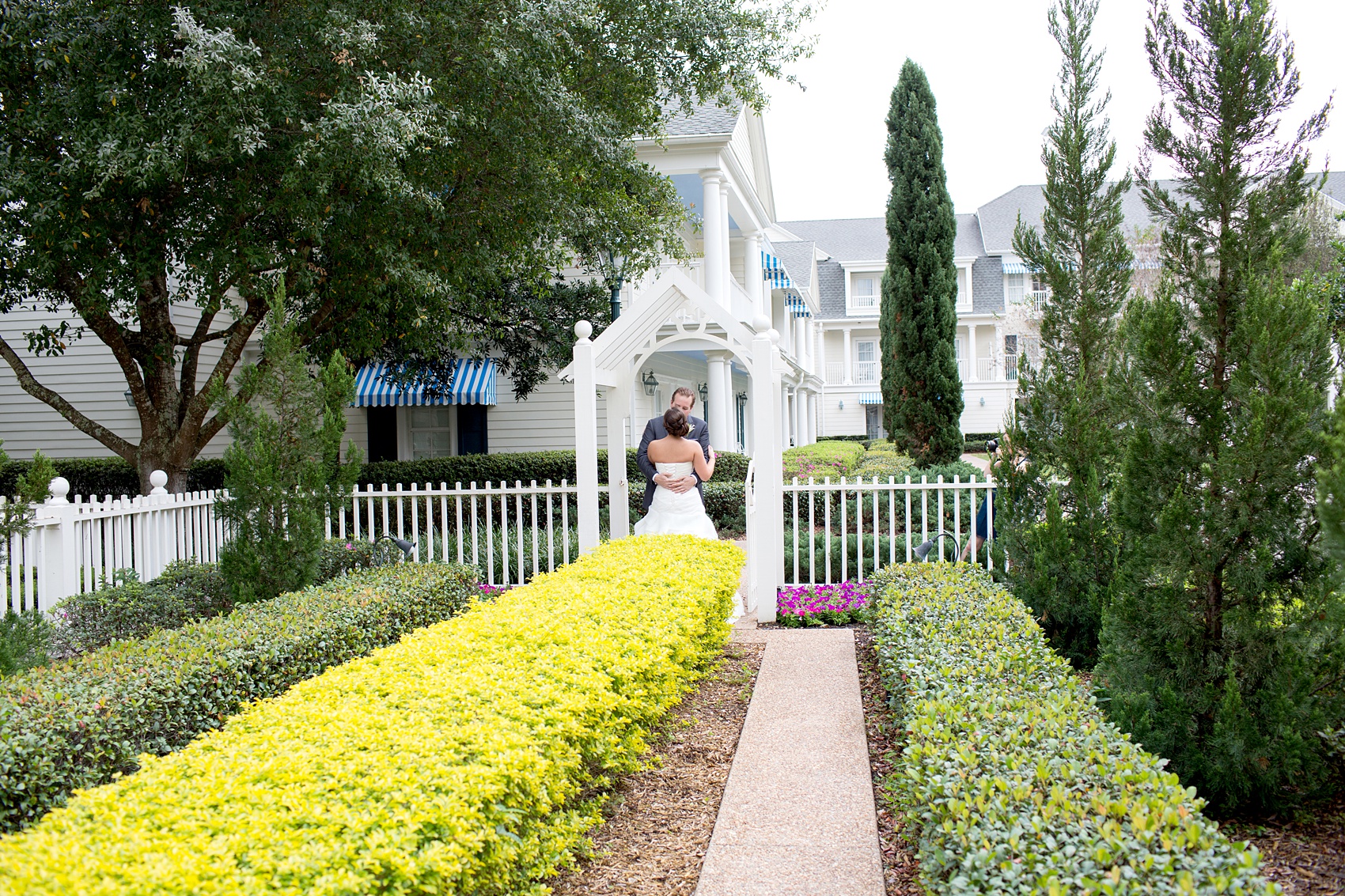 Walt Disney World wedding pictures at the Boardwalk venue, including a waterfront ceremony and Dance Hall reception near Epcot. These photos will give you unique, fun ideas from Glow in the Dark invitations to their Dole Whip flavored cake! Want to see more? Click through to Mikkel Paige Photography for more inspiration from this bride and groom's colorful day! #DisneyWedding #mikkelpaige #disneysboardwalk #DisneyWeddingVenue #DisneyBride #DisneyFan #MickeyEars