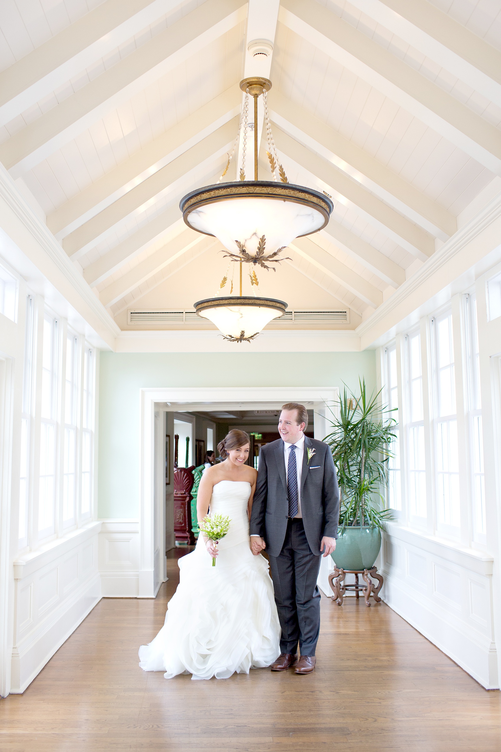 Walt Disney World wedding pictures at the Boardwalk venue, including a waterfront ceremony and Dance Hall reception near Epcot. These photos will give you unique, fun ideas from Glow in the Dark invitations to their Dole Whip flavored cake! Want to see more? Click through to Mikkel Paige Photography for more inspiration from this bride and groom's colorful day! #DisneyWedding #mikkelpaige #disneysboardwalk #DisneyWeddingVenue #DisneyBride #DisneyFan #MickeyEars