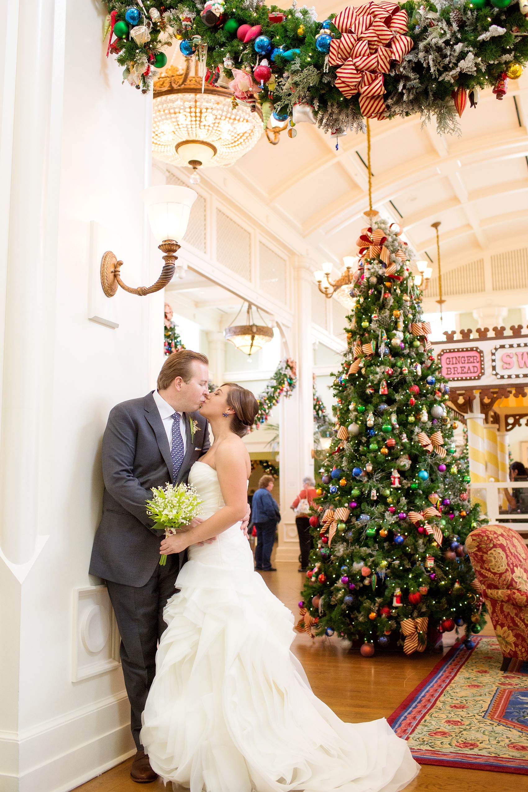 Walt Disney World wedding pictures at the Boardwalk venue, including a waterfront ceremony and Dance Hall reception near Epcot. These photos will give you unique, fun ideas from Glow in the Dark invitations to their Dole Whip flavored cake! Want to see more? Click through to Mikkel Paige Photography for more inspiration from this bride and groom's colorful day! #DisneyWedding #mikkelpaige #disneysboardwalk #DisneyWeddingVenue #DisneyBride #DisneyFan #MickeyEars