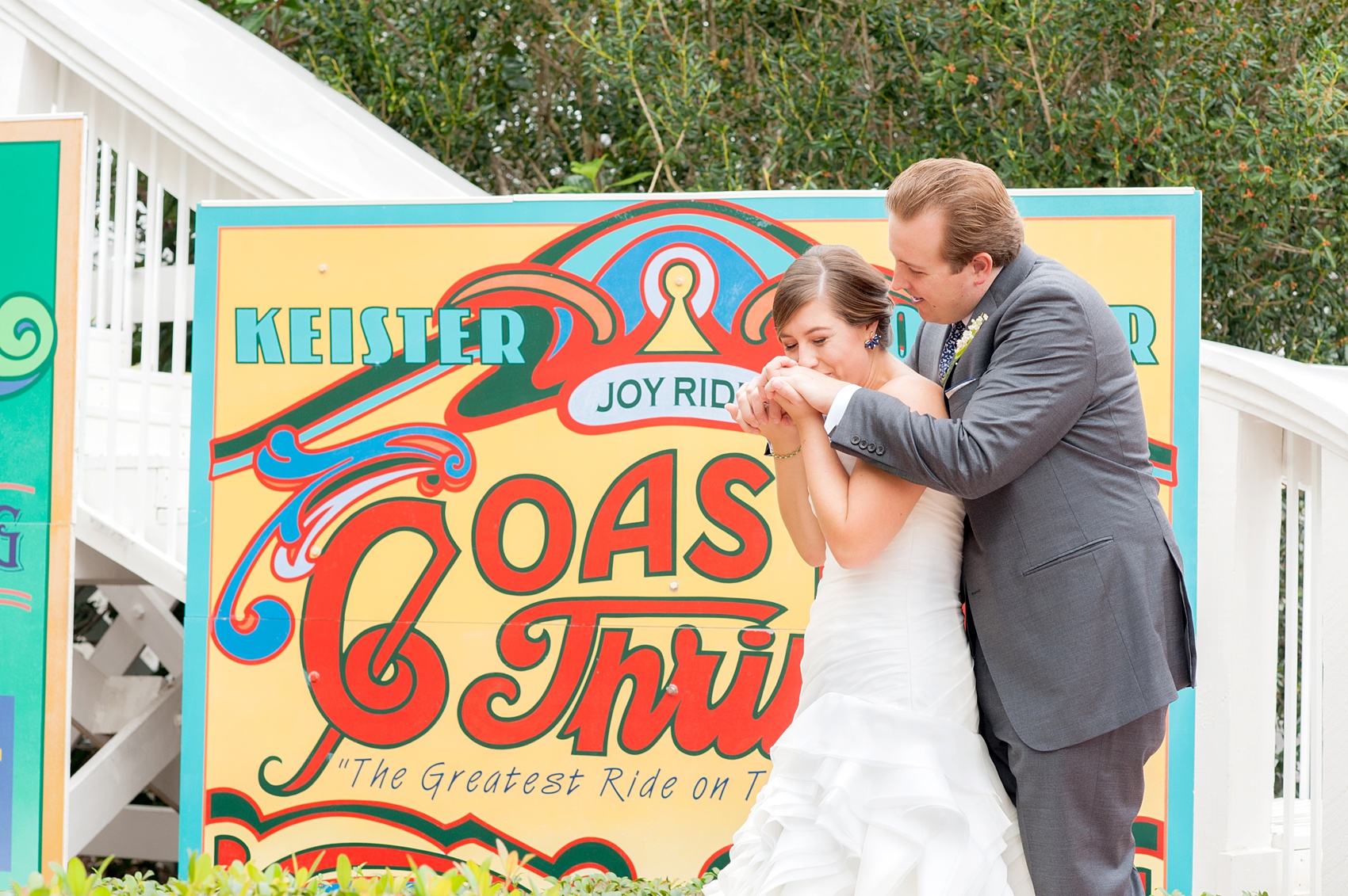 Walt Disney World wedding pictures at the Boardwalk venue, including a waterfront ceremony and Dance Hall reception near Epcot. These photos will give you unique, fun ideas from Glow in the Dark invitations to their Dole Whip flavored cake! Want to see more? Click through to Mikkel Paige Photography for more inspiration from this bride and groom's colorful day! #DisneyWedding #mikkelpaige #disneysboardwalk #DisneyWeddingVenue #DisneyBride #DisneyFan #MickeyEars