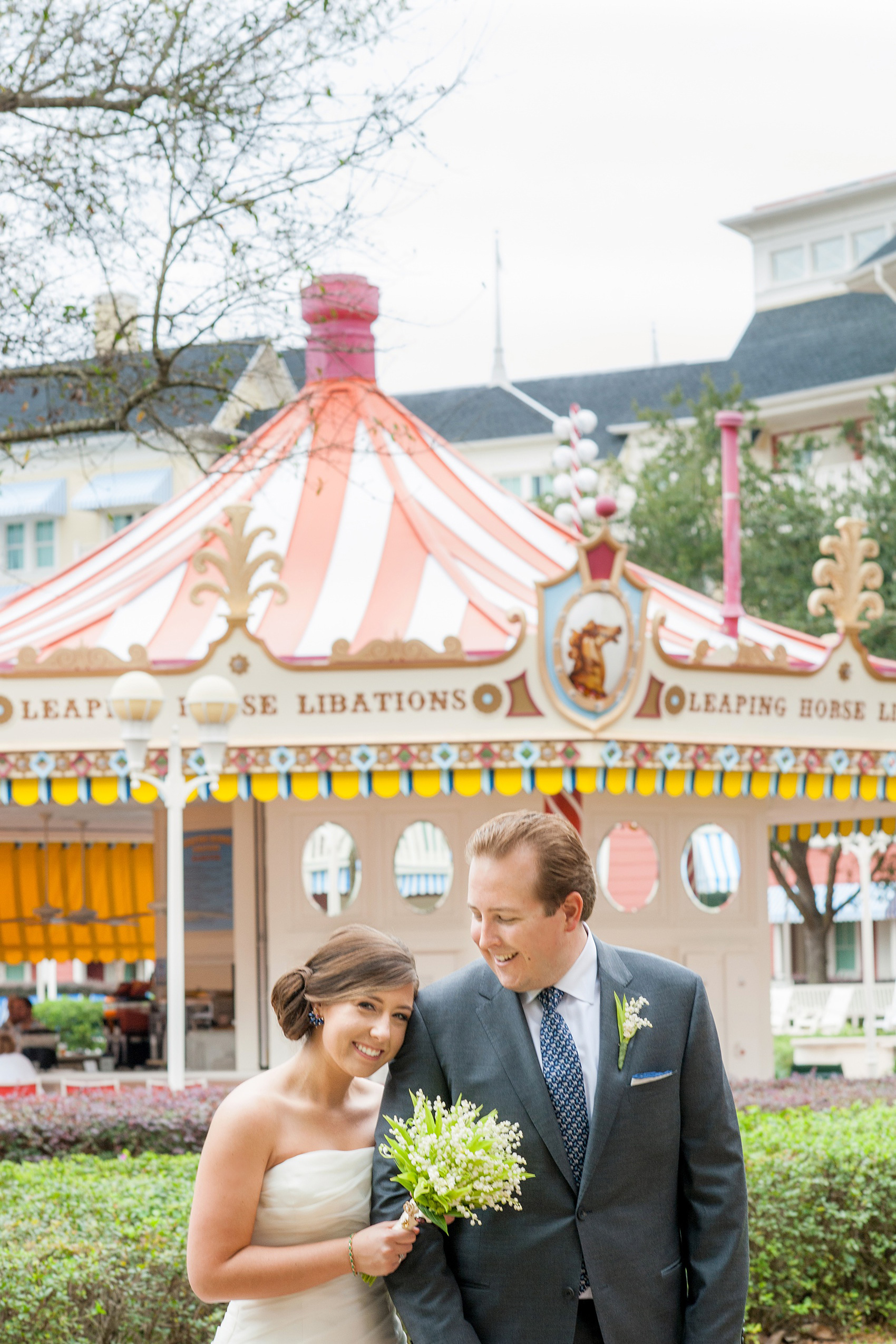 Walt Disney World wedding pictures at the Boardwalk venue, including a waterfront ceremony and Dance Hall reception near Epcot. These photos will give you unique, fun ideas from Glow in the Dark invitations to their Dole Whip flavored cake! Want to see more? Click through to Mikkel Paige Photography for more inspiration from this bride and groom's colorful day! #DisneyWedding #mikkelpaige #disneysboardwalk #DisneyWeddingVenue #DisneyBride #DisneyFan #MickeyEars