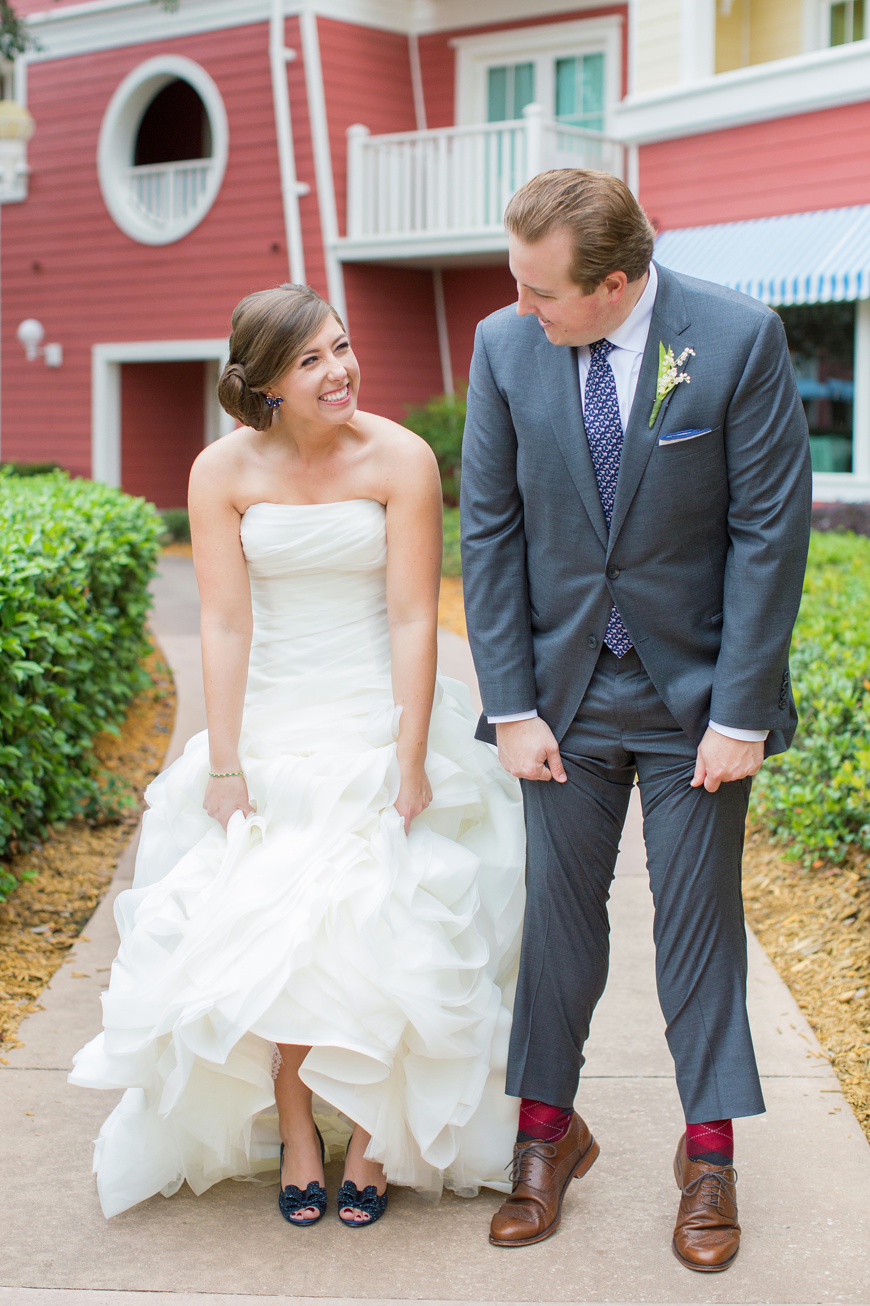 Walt Disney World wedding pictures at the Boardwalk venue, including a waterfront ceremony and Dance Hall reception near Epcot. These photos will give you unique, fun ideas from Glow in the Dark invitations to their Dole Whip flavored cake! Want to see more? Click through to Mikkel Paige Photography for more inspiration from this bride and groom's colorful day! #DisneyWedding #mikkelpaige #disneysboardwalk #DisneyWeddingVenue #DisneyBride #DisneyFan #MickeyEars