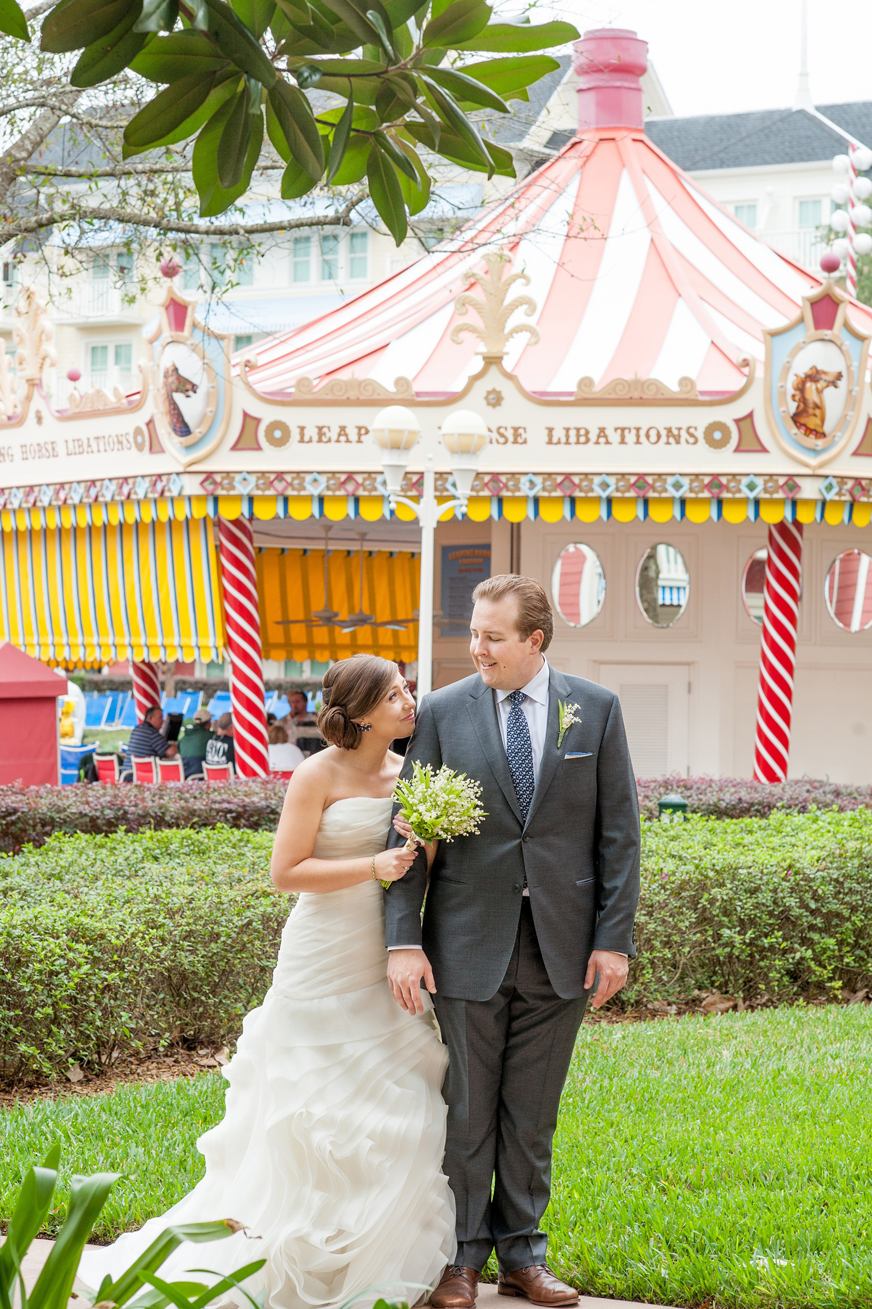 Walt Disney World wedding pictures at the Boardwalk venue, including a waterfront ceremony and Dance Hall reception near Epcot. These photos will give you unique, fun ideas from Glow in the Dark invitations to their Dole Whip flavored cake! Want to see more? Click through to Mikkel Paige Photography for more inspiration from this bride and groom's colorful day! #DisneyWedding #mikkelpaige #disneysboardwalk #DisneyWeddingVenue #DisneyBride #DisneyFan #MickeyEars