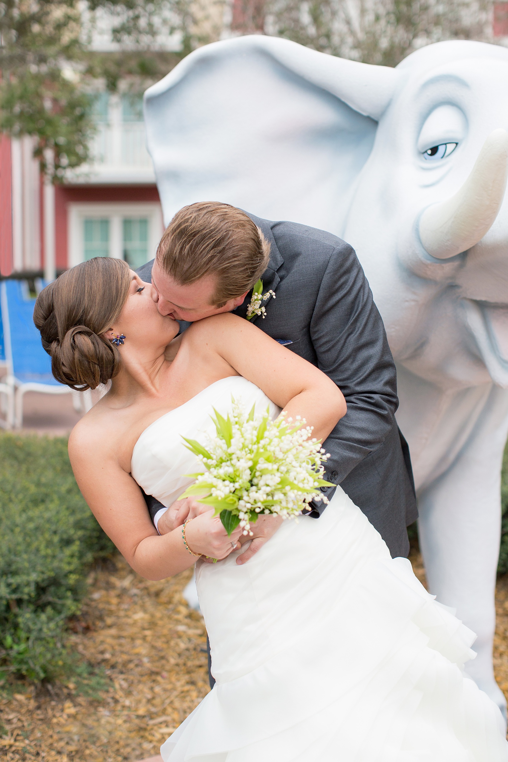 Walt Disney World wedding pictures at the Boardwalk venue, including a waterfront ceremony and Dance Hall reception near Epcot. These photos will give you unique, fun ideas from Glow in the Dark invitations to their Dole Whip flavored cake! Want to see more? Click through to Mikkel Paige Photography for more inspiration from this bride and groom's colorful day! #DisneyWedding #mikkelpaige #disneysboardwalk #DisneyWeddingVenue #DisneyBride #DisneyFan #MickeyEars