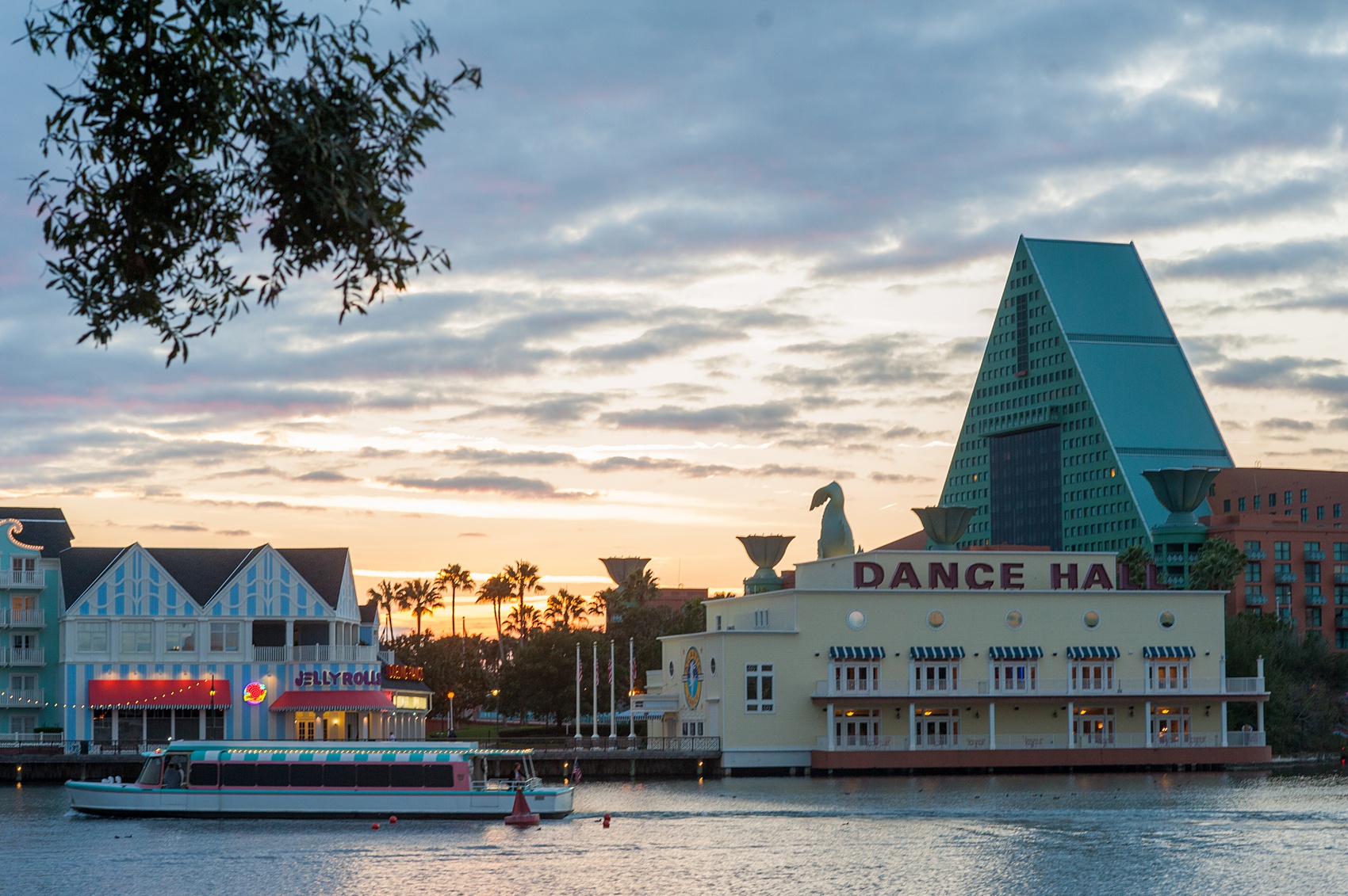 Walt Disney World wedding pictures at the Boardwalk venue, including a waterfront ceremony and Dance Hall reception near Epcot. These photos will give you unique, fun ideas from Glow in the Dark invitations to their Dole Whip flavored cake! Want to see more? Click through to Mikkel Paige Photography for more inspiration from this bride and groom's colorful day! #DisneyWedding #mikkelpaige #disneysboardwalk #DisneyWeddingVenue #DisneyBride #DisneyFan #MickeyEars