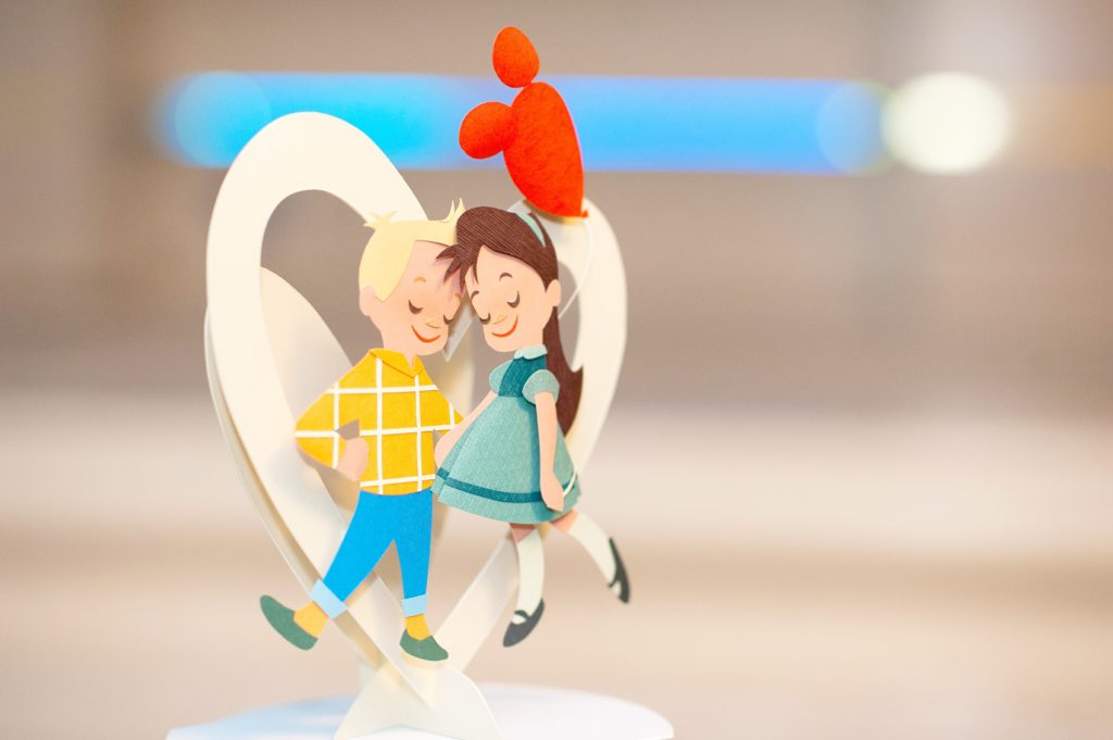 Walt Disney World wedding pictures at the Boardwalk venue, including a waterfront ceremony and Dance Hall reception near Epcot. These photos will give you unique, fun ideas from Glow in the Dark invitations to their Dole Whip flavored cake with a custom cake topper and 