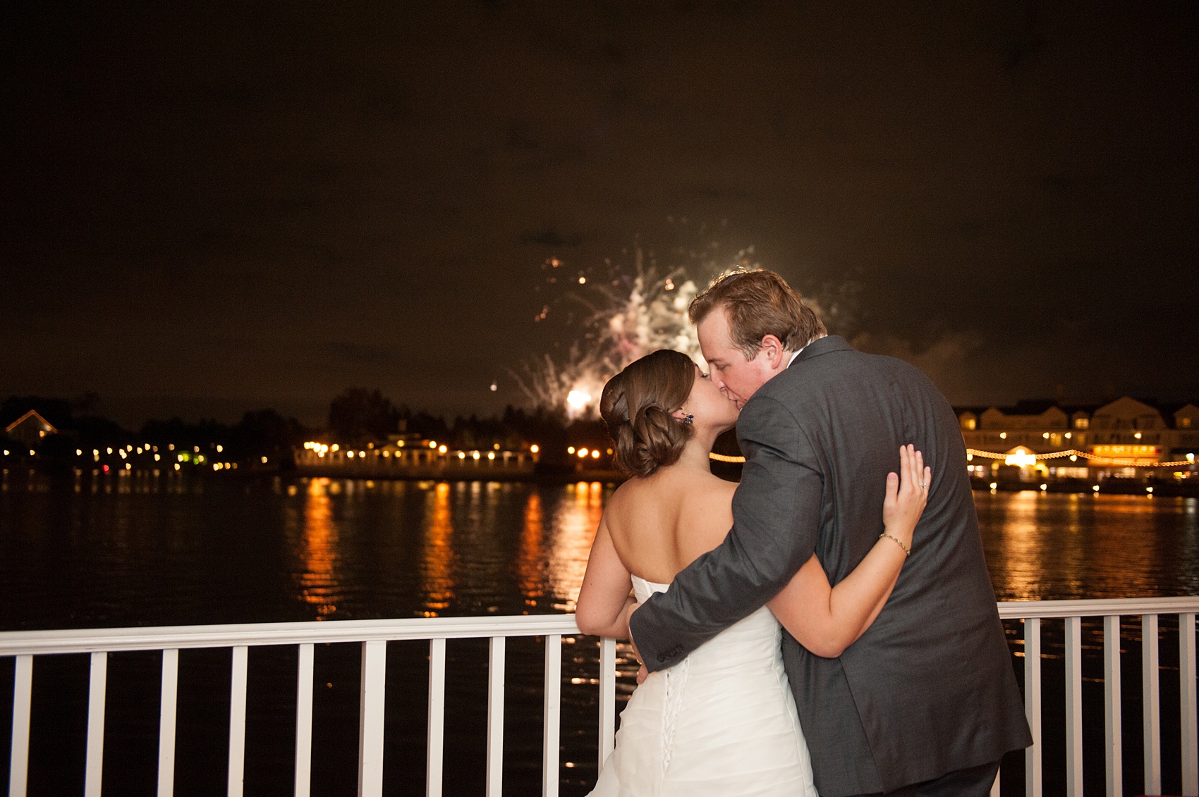 Walt Disney World wedding pictures at the Boardwalk venue, including a waterfront ceremony and Dance Hall reception near Epcot. These photos will give you unique, fun ideas from Glow in the Dark invitations to their Dole Whip flavored cake! Want to see more? Click through to Mikkel Paige Photography for more inspiration from this bride and groom's colorful day! #DisneyWedding #mikkelpaige #disneysboardwalk #DisneyWeddingVenue #DisneyBride #DisneyFan #MickeyEars #Fireworks