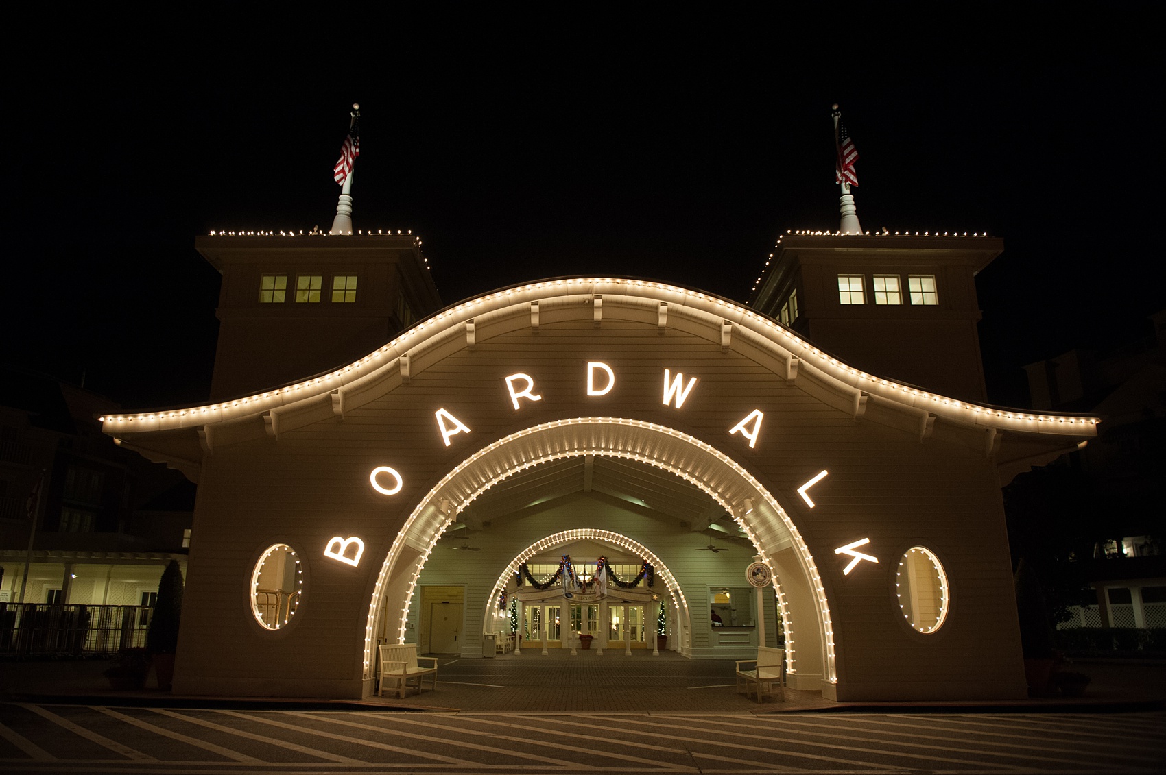 Walt Disney World wedding pictures at the Boardwalk venue, including a waterfront ceremony and Dance Hall reception near Epcot. These photos will give you unique, fun ideas from Glow in the Dark invitations to their Dole Whip flavored cake! Want to see more? Click through to Mikkel Paige Photography for more inspiration from this bride and groom's colorful day! #DisneyWedding #mikkelpaige #disneysboardwalk #DisneyWeddingVenue #DisneyBride #DisneyFan #MickeyEars