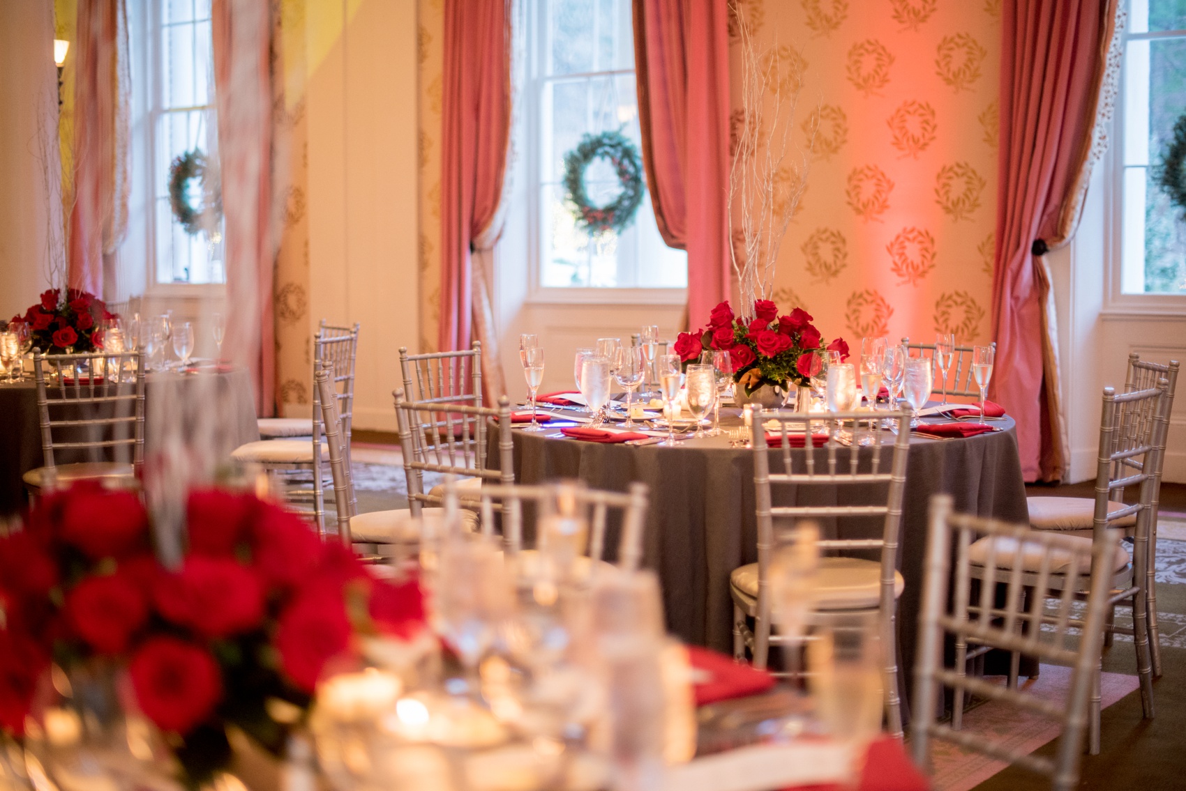 Omni Bedford Springs Resort wedding photos by Mikkel Paige Photography. Christmas holiday winter wonderland day with red and white color palette. Red roses and grey table linens with chalkboard signs.