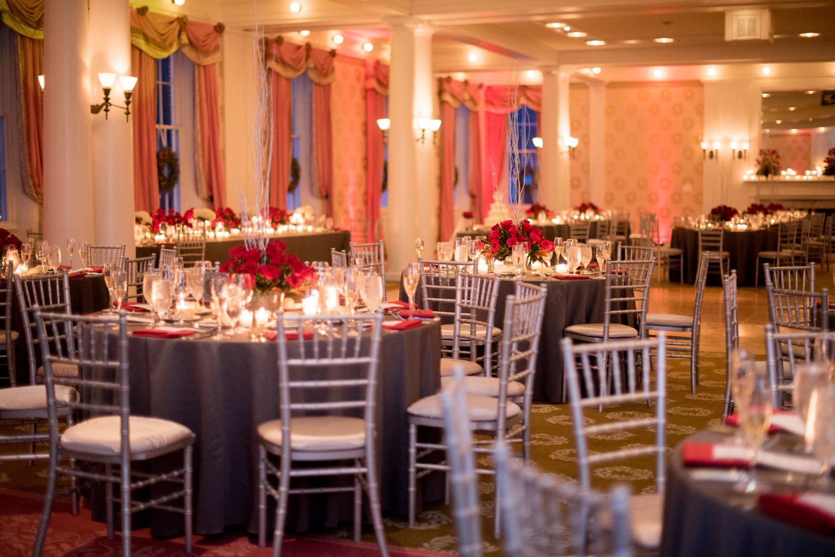 Omni Bedford Springs Resort wedding photos by Mikkel Paige Photography. Christmas holiday winter wonderland day with red and white color palette. Red roses and grey table linens with chalkboard signs.