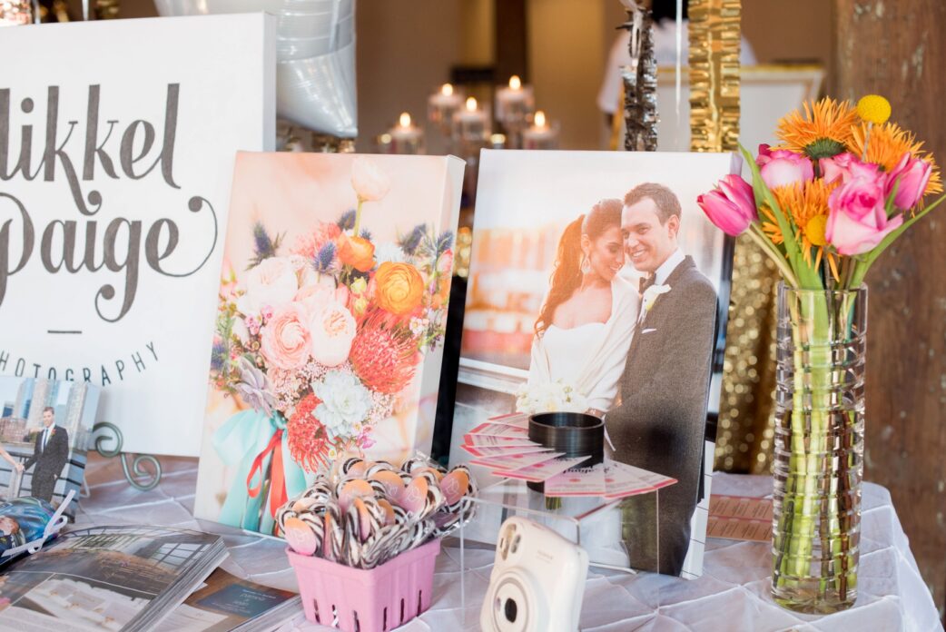The Cloth Mill North Carolina wedding vendor showcase. Photographer Mikkel Paige Photography's table display with canvases and business cards.